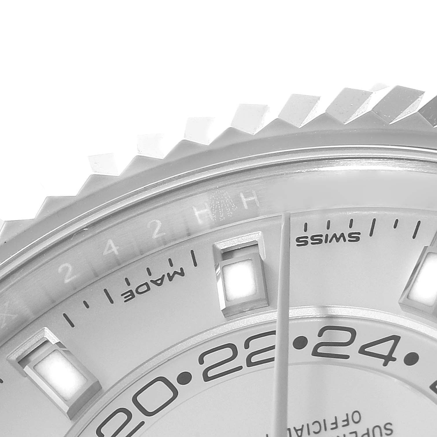 A close-up shot of the Rolex Sky-Dweller 326934 Men's Stainless Steel White Dial 326934 Men's Stainless Steel White Dial's dial shows the bezel, hour markers, and partial 24-hour display.