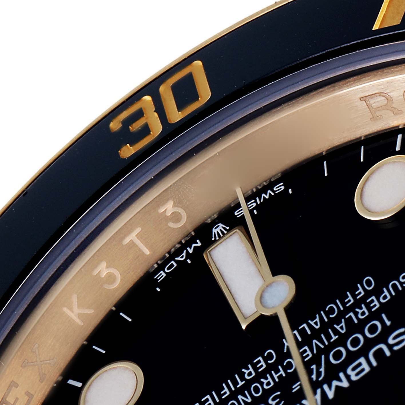 This image shows a close-up of the dial and bezel of a Rolex Submariner 126618 Men
s Yellow Gold Black Dial 126618 Men
s Yellow Gold Black Dial watch, highlighting the "30" mark and some text details.