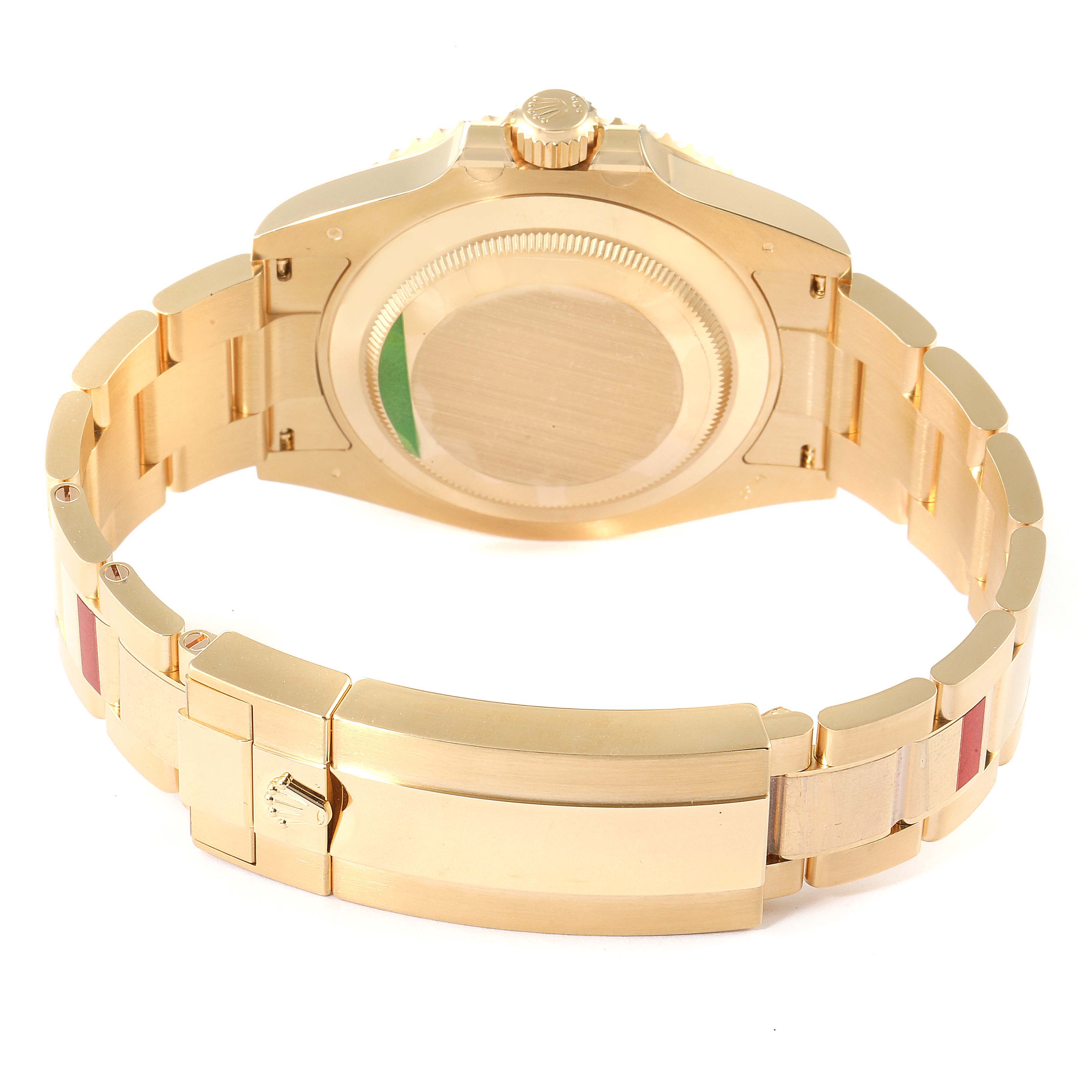 The image shows the back side of a Rolex Submariner 126618 Men
s Yellow Gold Black Dial 126618 Men
s Yellow Gold Black Dial watch, focusing on the bracelet clasp and case back.