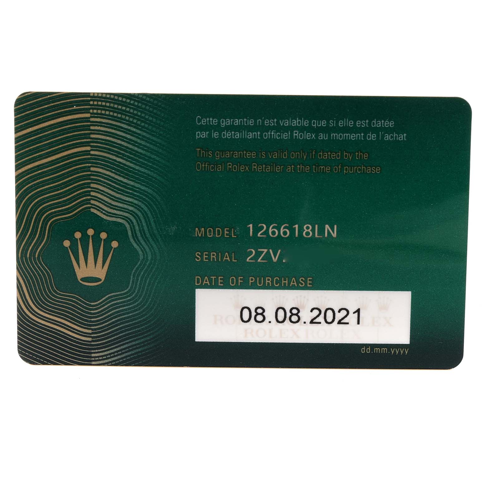The image shows a close-up of the authenticity and purchase card for a Rolex Submariner 126618 Men's Yellow Gold Black Dial 126618 Men's Yellow Gold Black Dial model 126618LN.