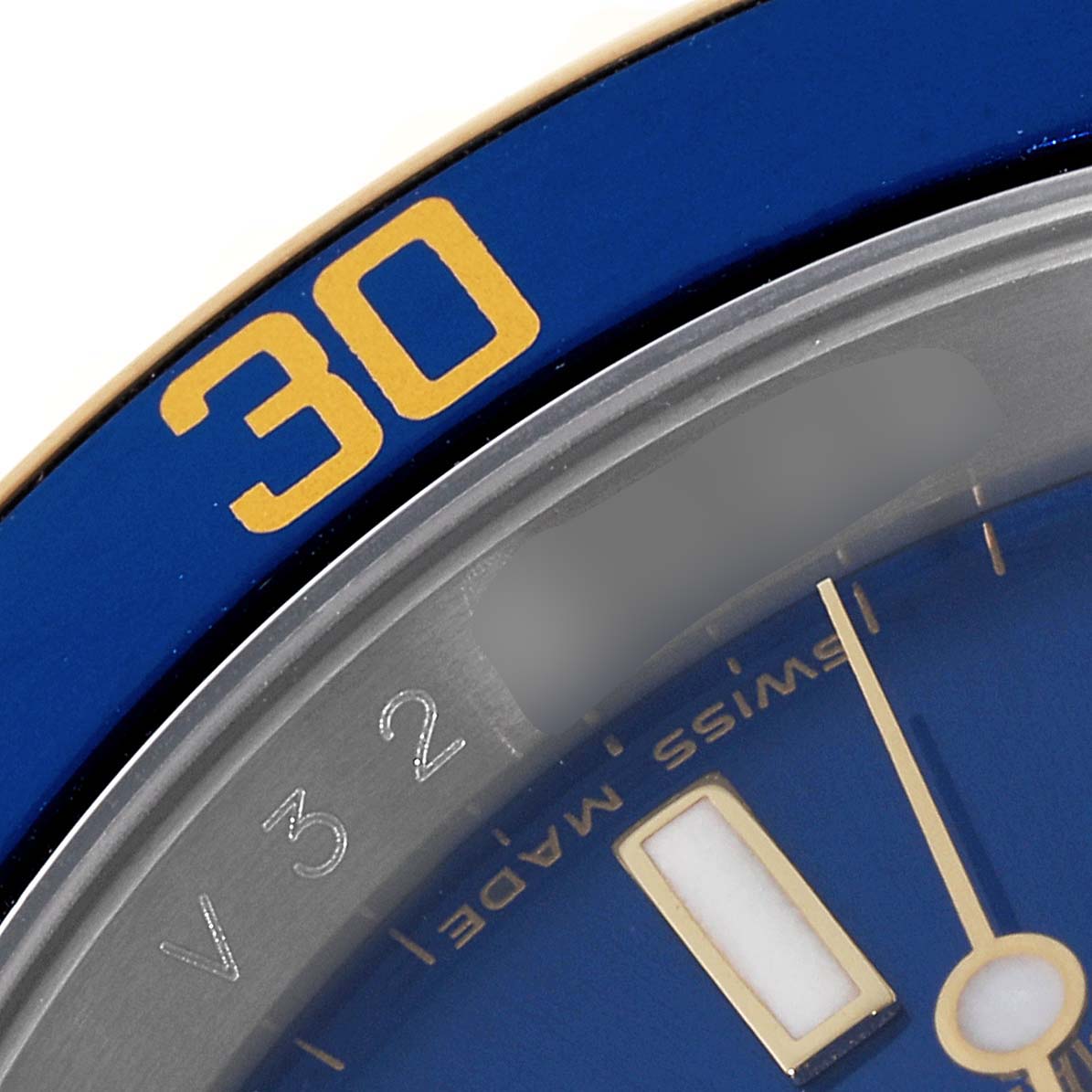 This close-up image shows the bezel with the "30" marking, and part of the dial and hour marker of the Rolex Submariner 16613 Men's Steel and Gold (two tone) Blue Dial 16613 Men's Steel and Gold (two tone) Blue Dial watch.