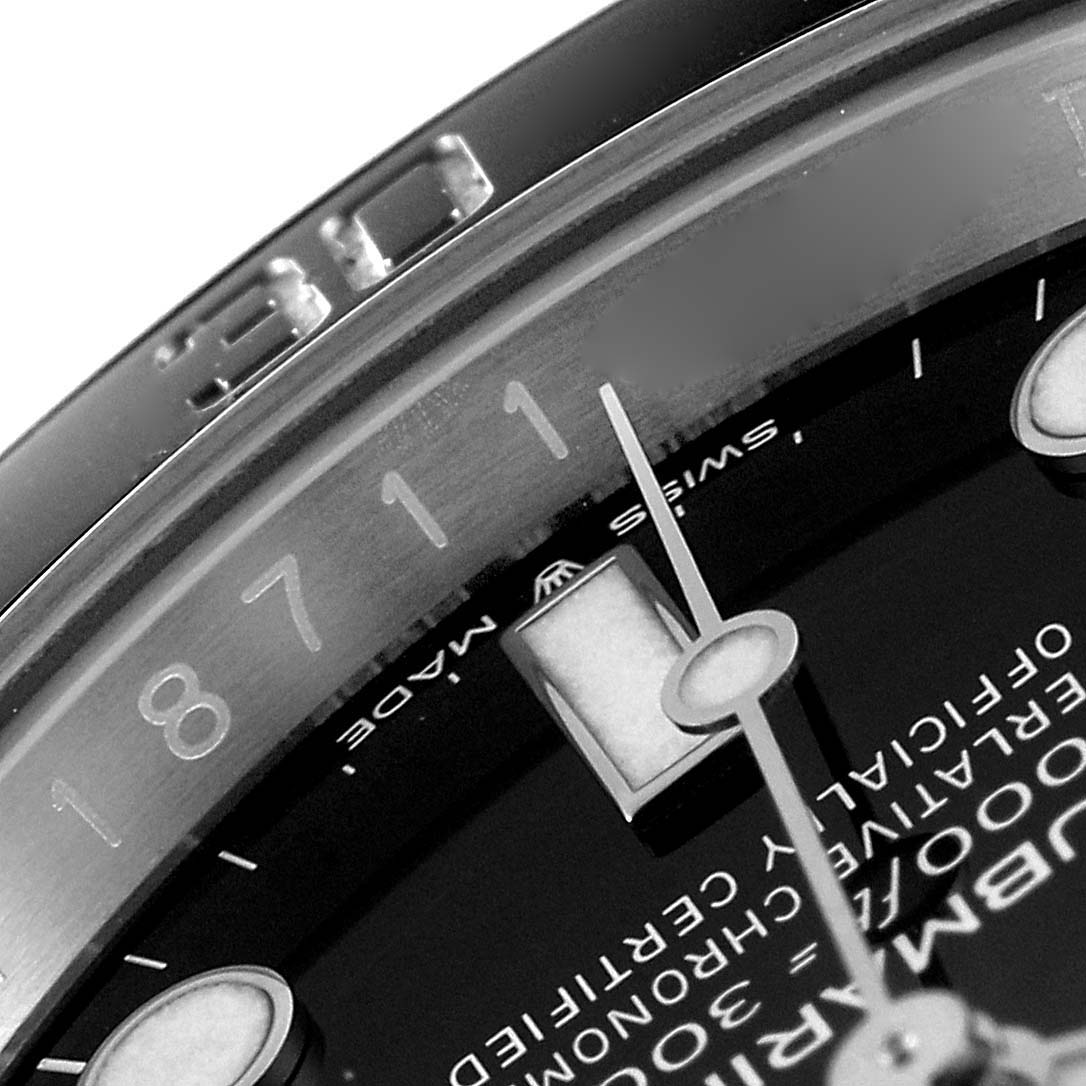 The image shows a close-up of the Rolex Submariner 126610 Men
s Stainless Steel Black Dial 126610 Men
s Stainless Steel Black Dial watch, highlighting part of the bezel, dial, and hour hand.