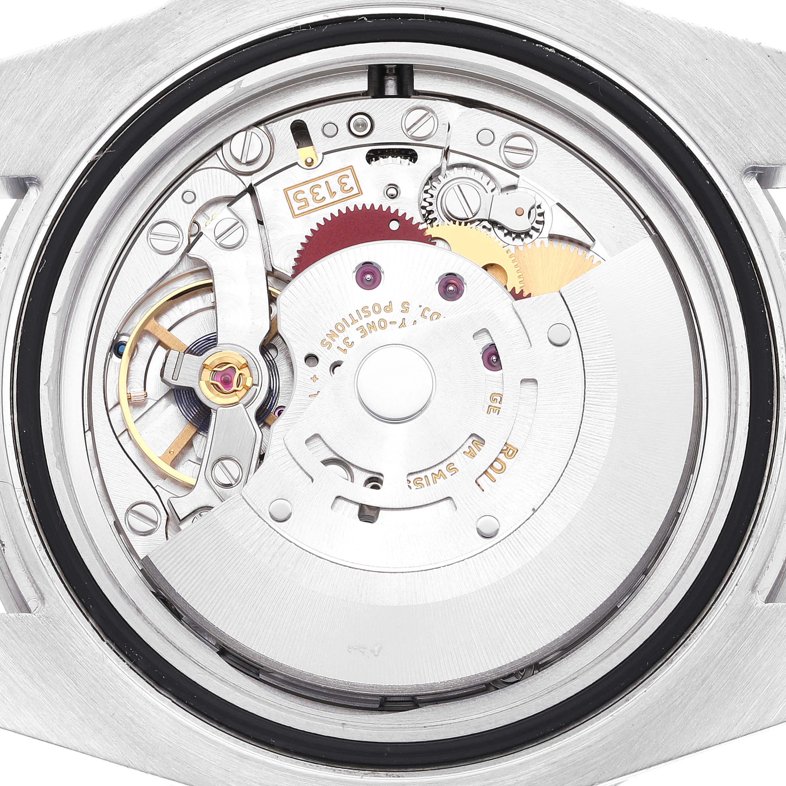 The image shows the intricate internal mechanism of a Rolex Submariner 116610LV Men
s Stainless Steel Green Dial 116610LV Men
s Stainless Steel Green Dial, viewed from the back case.