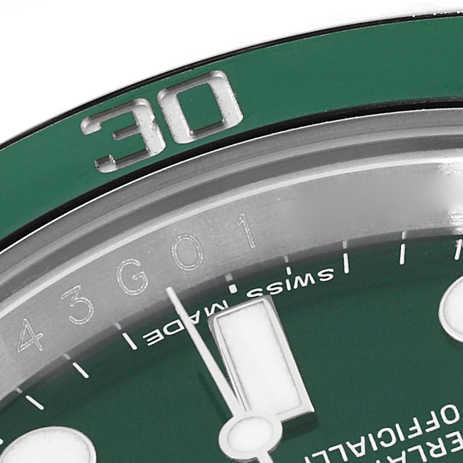 The image shows a close-up of the bezel and dial of a green Rolex Submariner 116610LV Men
s Stainless Steel Green Dial 116610LV Men
s Stainless Steel Green Dial, focusing on the "30" mark and part of the minute hand.