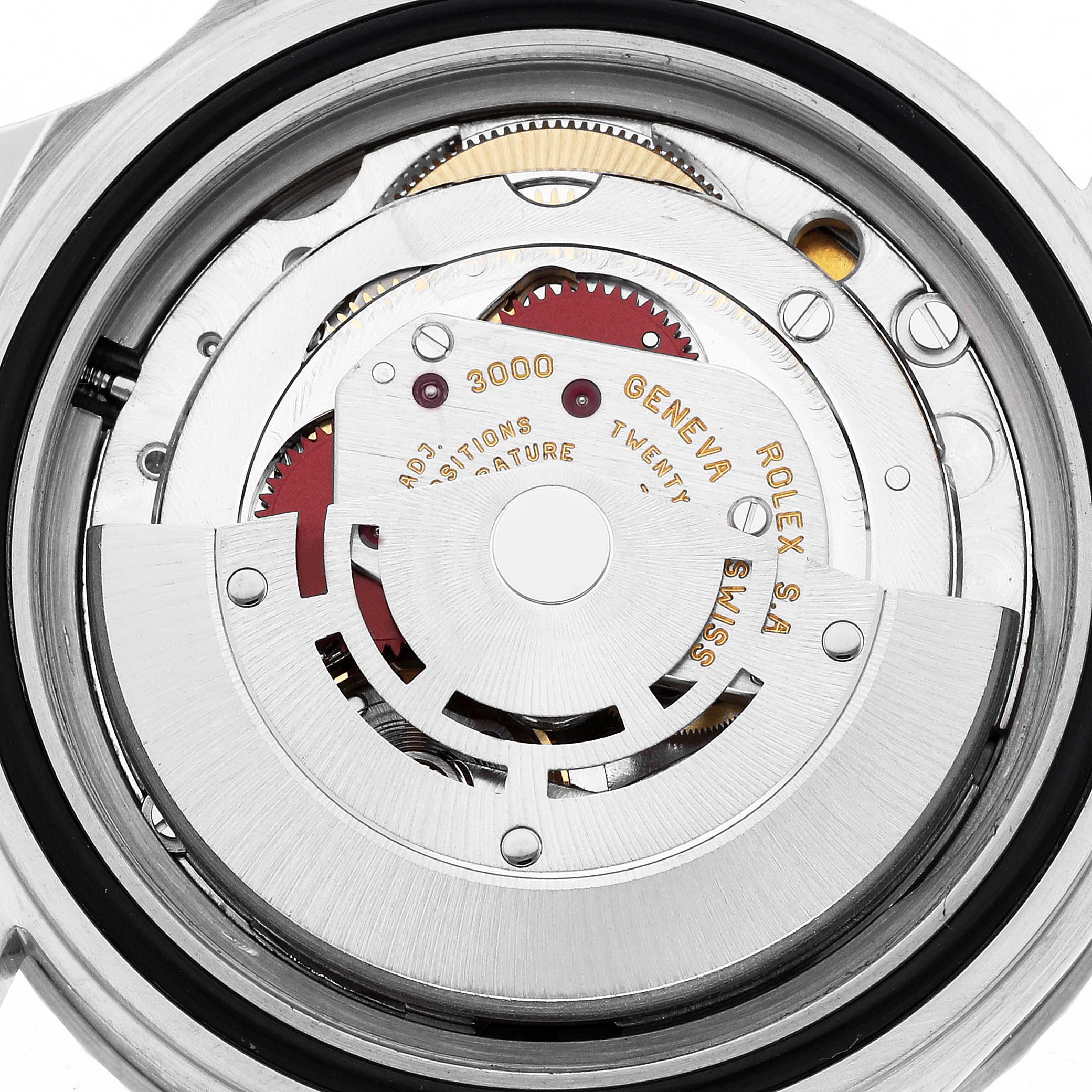 The image shows the inner mechanics of a Rolex Submariner 14060 Men
s Stainless Steel Black Dial watch, viewed from the back, highlighting its movement and intricate gears.