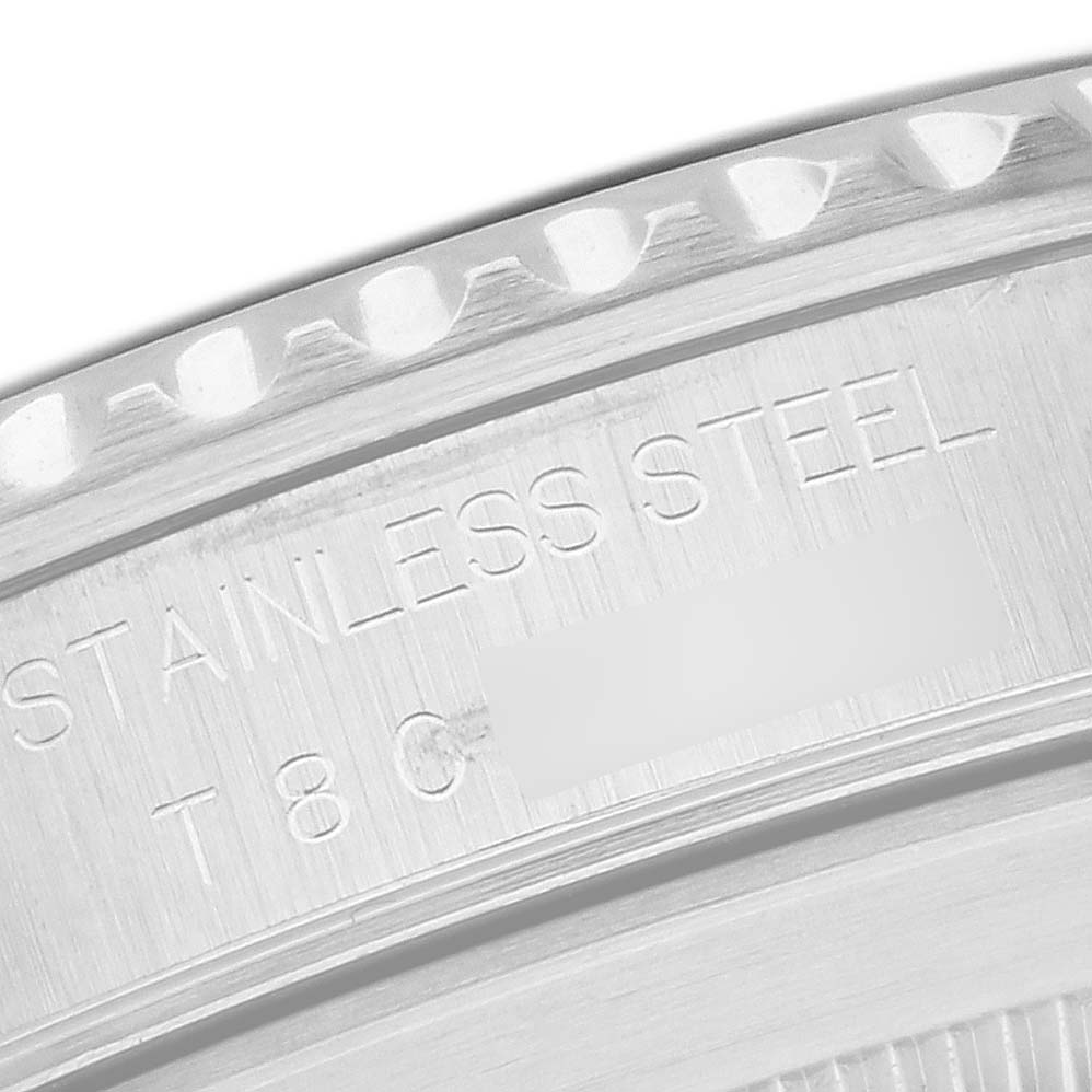 The image shows a close-up of the engraved case back edge of a Rolex Submariner 14060 Men
s Stainless Steel Black Dial, highlighting the stainless steel material.