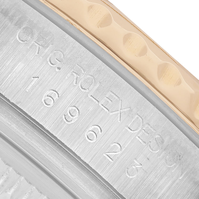 The image shows a close-up angle of the Rolex Yacht-Master 169623 Women's Steel and Gold (two tone) Blue Dial bezel, highlighting engravings and textures.