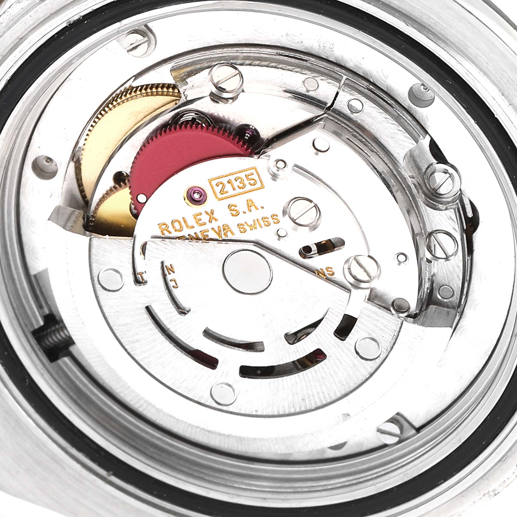 This image shows a close-up of the movement mechanism inside a Rolex Yacht-Master 68623 Men
s Steel and Gold (two tone) Grey Dial 68623 Men
s Steel and Gold (two tone) Grey Dial watch, specifically the 2135 caliber.