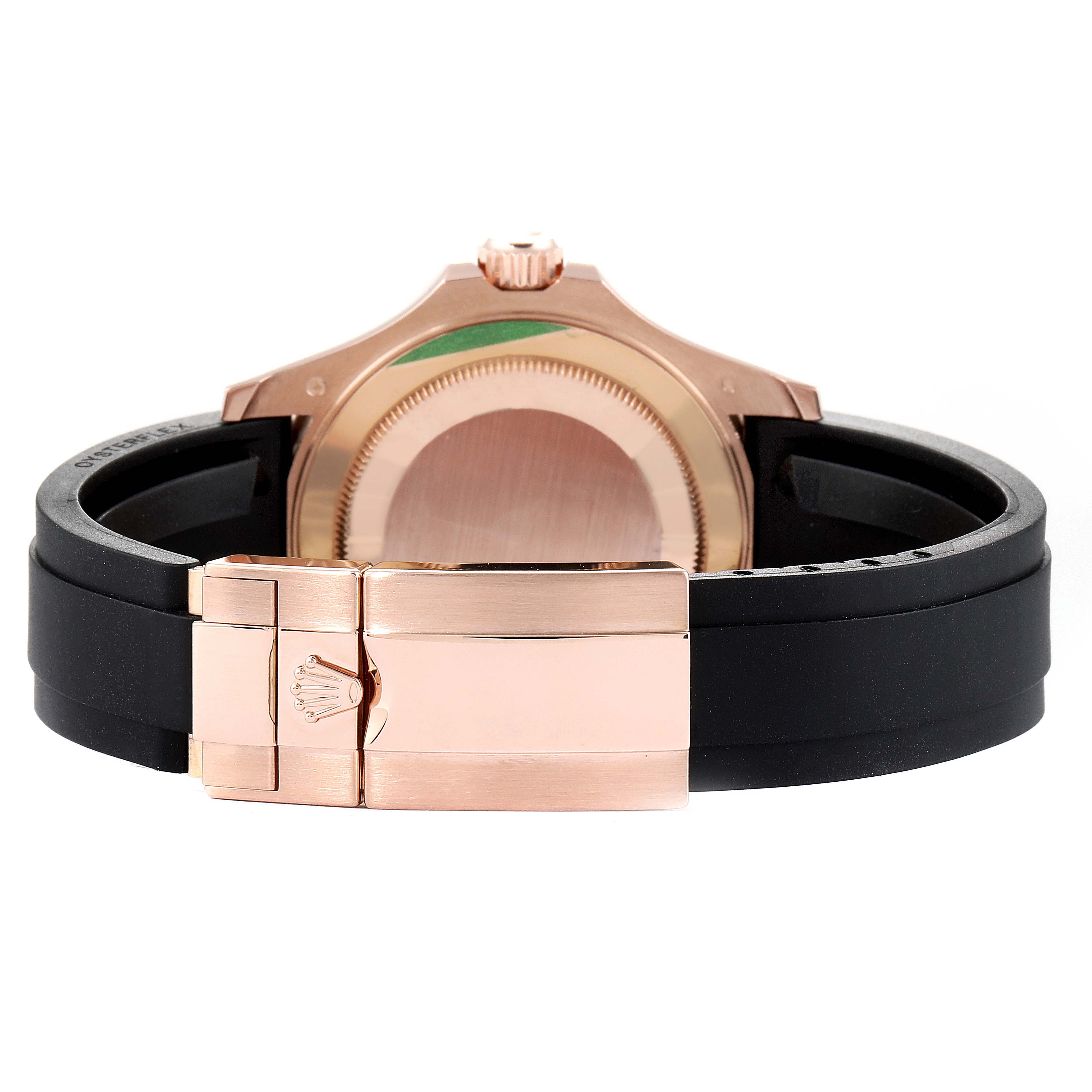 This image shows the case back, crown, and clasp of the Rolex Yacht-Master 116655 Men
s Rose Gold Black Dial 116655 Men
s Rose Gold Black Dial watch, with a black rubber strap and rose gold elements.