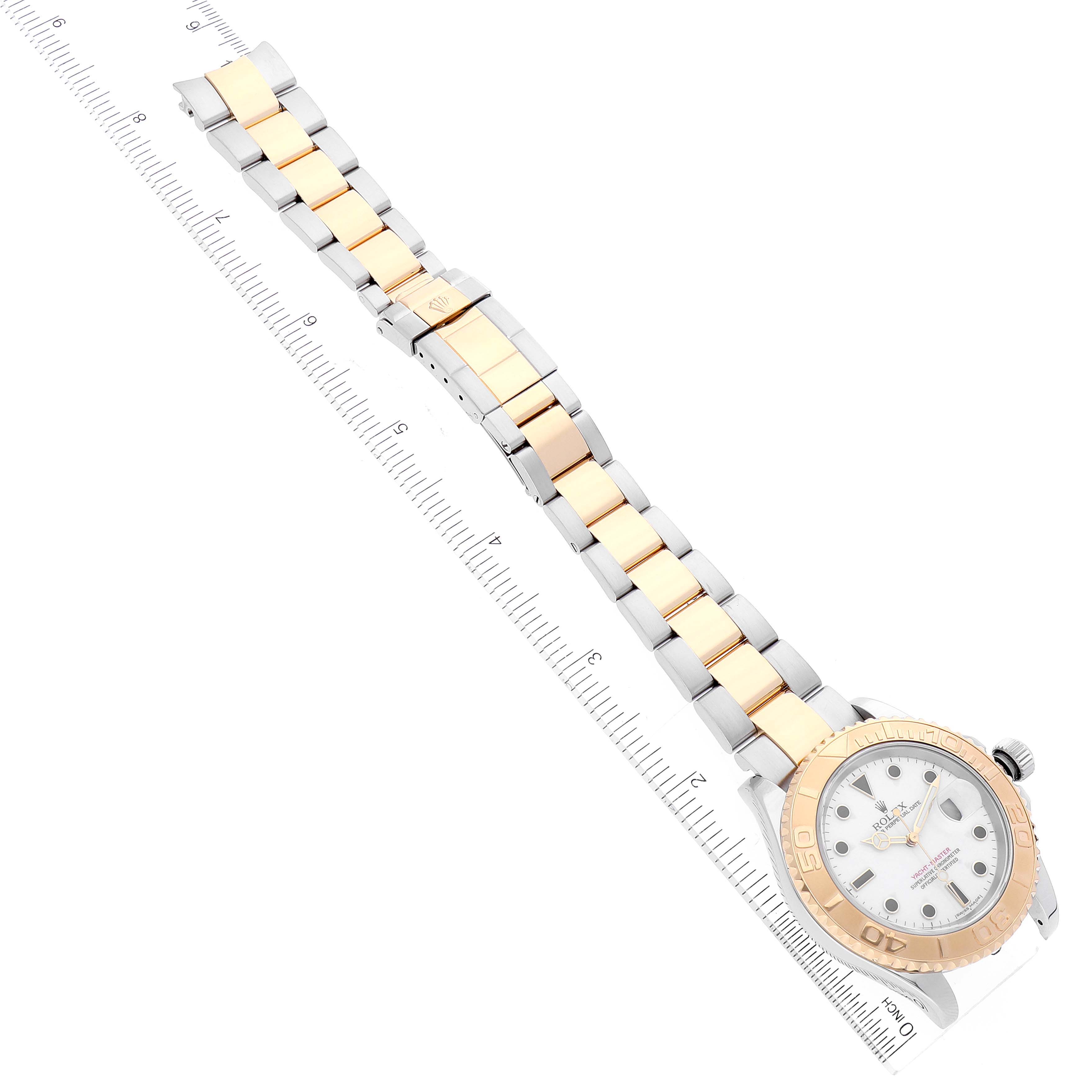 The image shows a top-down view of a Rolex Yacht-Master 16623 Men
s Steel and Gold (two tone) White Dial 16623 Men
s Steel and Gold (two tone) White Dial watch, featuring its bezel, crown, dial, and two-tone bracelet.