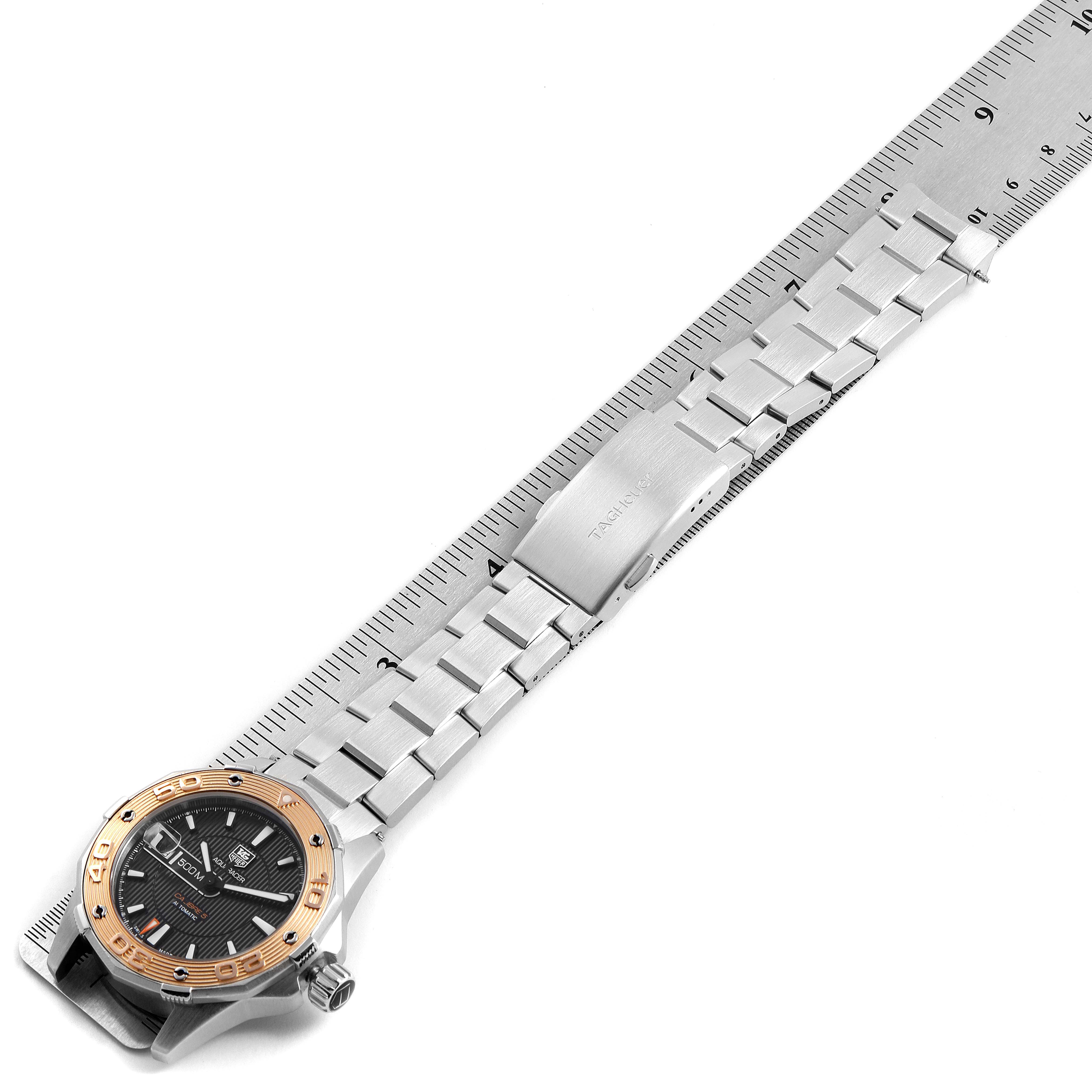 The image shows a side angle of a Tag Heuer Aquaracer WAJ2150.BA0870 Men
s Stainless Steel Black Dial WAJ2150.BA0870 Men
s Stainless Steel Black Dial watch, highlighting the face, band, and clasp.