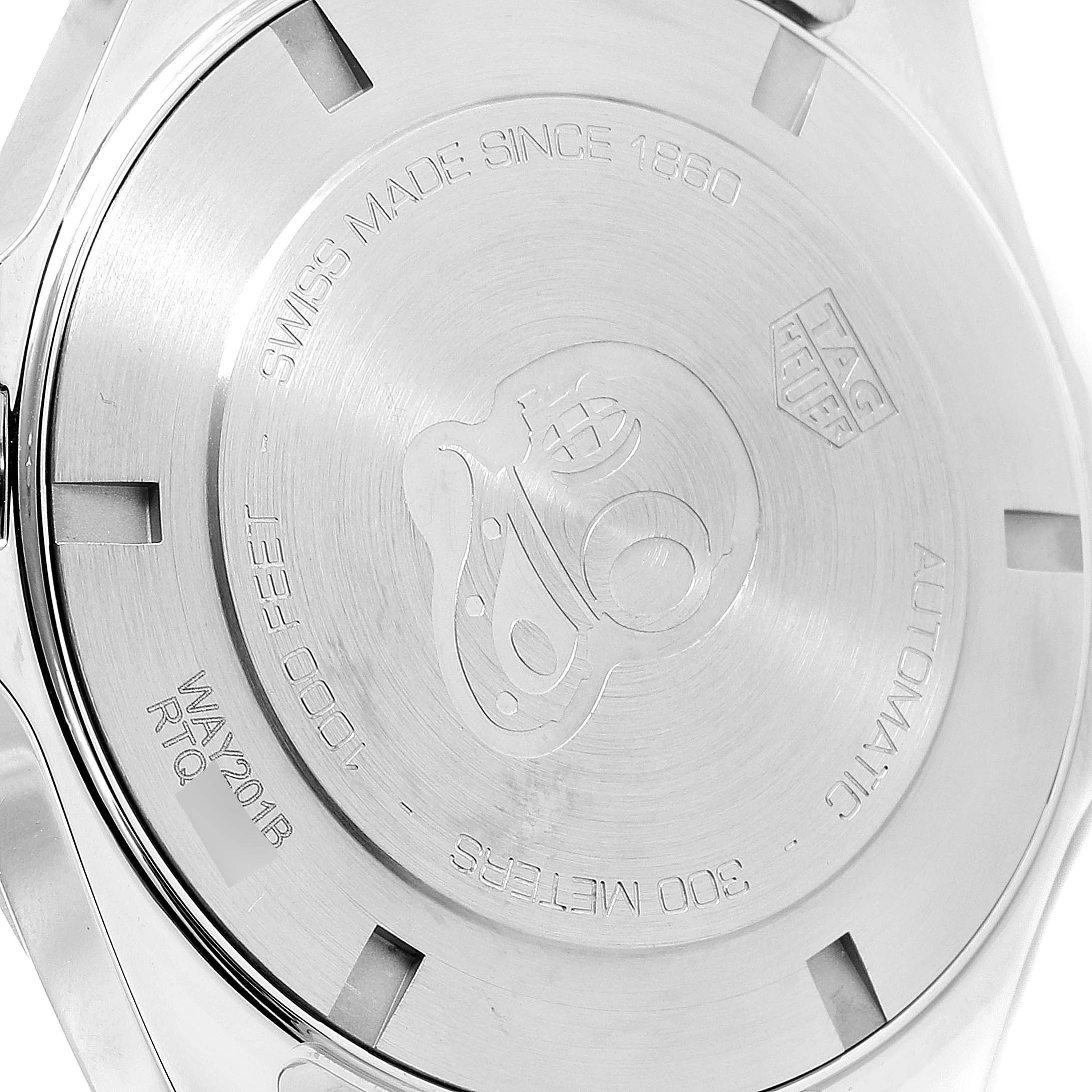 This image shows the back cover of a Tag Heuer Aquaracer WAY201B Men
s Stainless Steel Blue Dial WAY201B Men
s Stainless Steel Blue Dial watch, displaying engravings and branding.