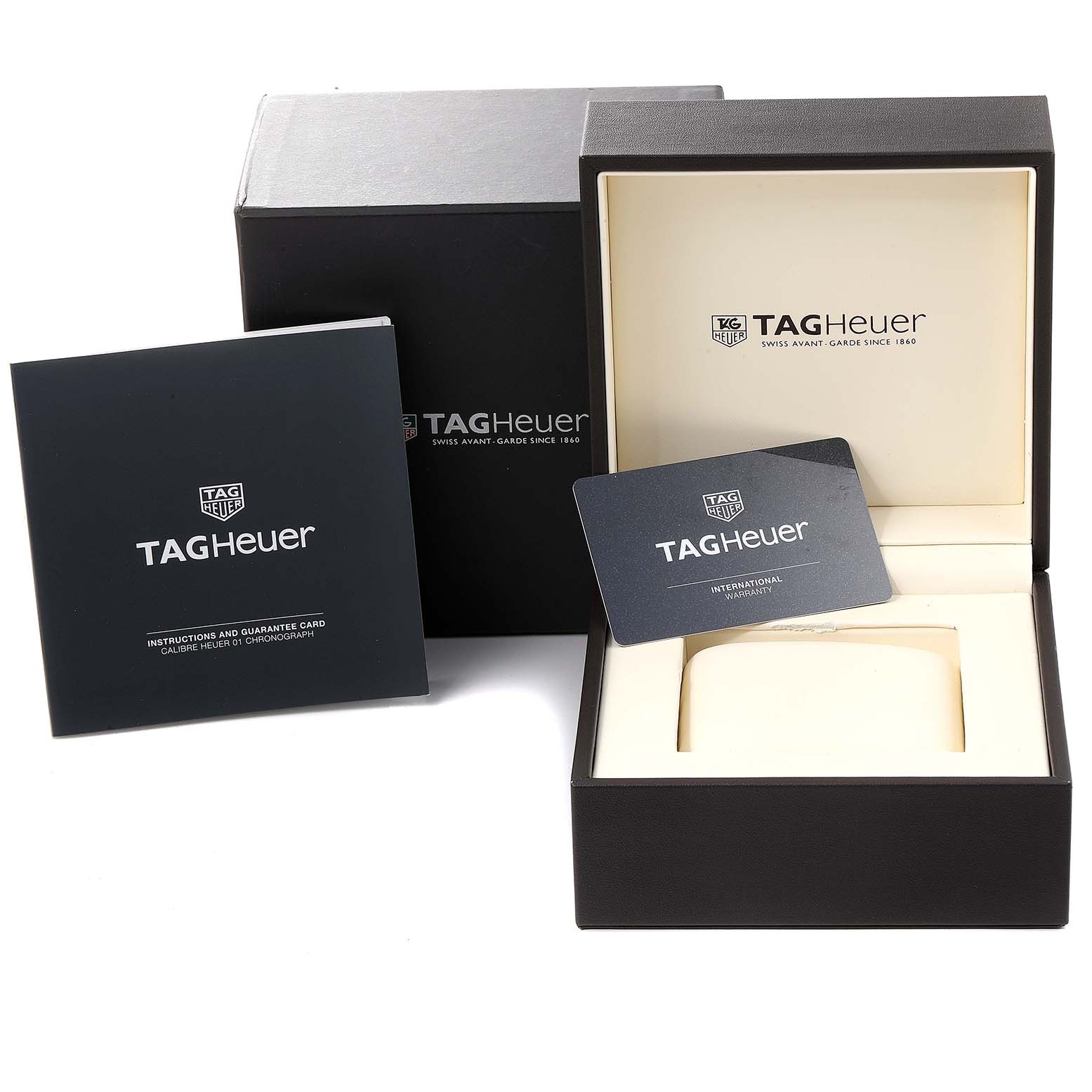 The image shows an open packaging box for a Carrera model by Tag Heuer, displaying a warranty card and instructions booklet.