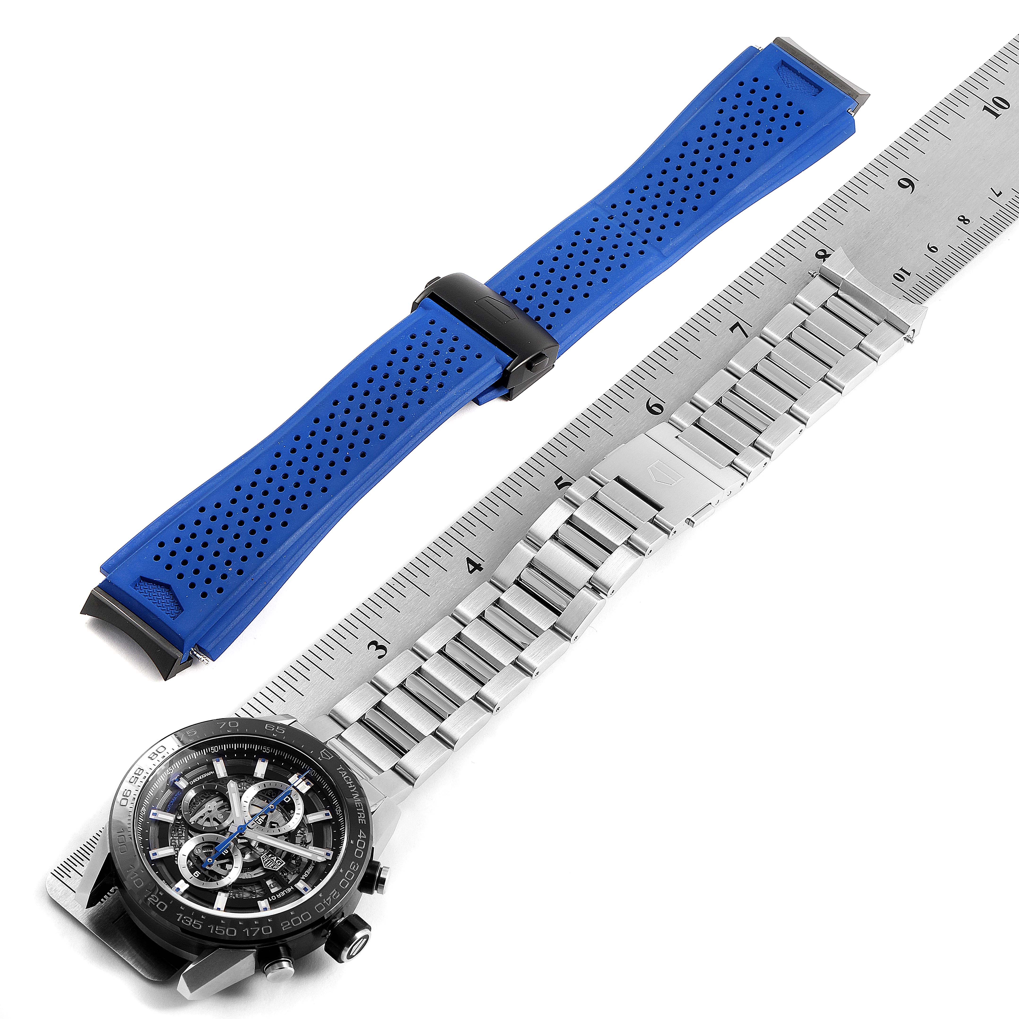 The image shows interchangeable bands and face of a Tag Heuer Carrera CAR2A1T Men's Titanium Black Dial CAR2A1T Men's Titanium Black Dial watch, with a ruler for scale.