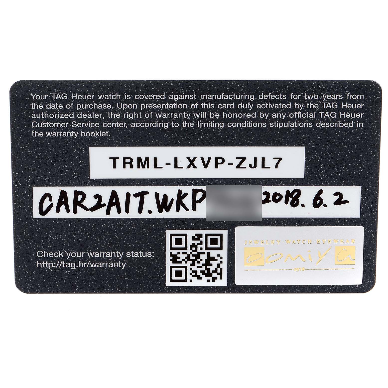 This image shows a warranty card for a Tag Heuer Carrera CAR2A1T Men's Titanium Black Dial CAR2A1T Men's Titanium Black Dial model watch, displaying the warranty code, date, and QR code.