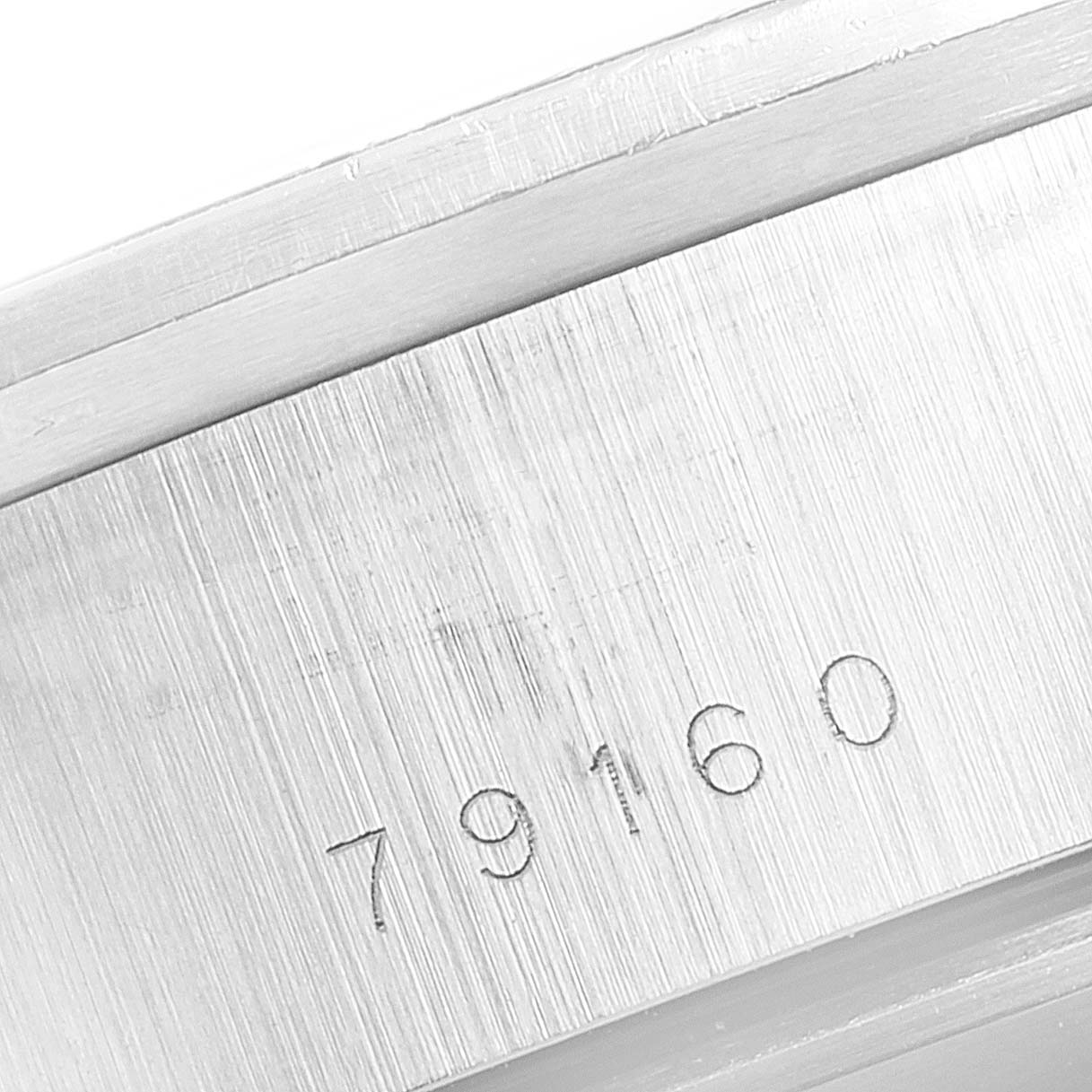 This photo shows a close-up angle of the Tudor Big Block 79160 Men
s Stainless Steel Black Dial 79160 Men
s Stainless Steel Black Dial model
s brushed case side with the model number "79160" engraved.