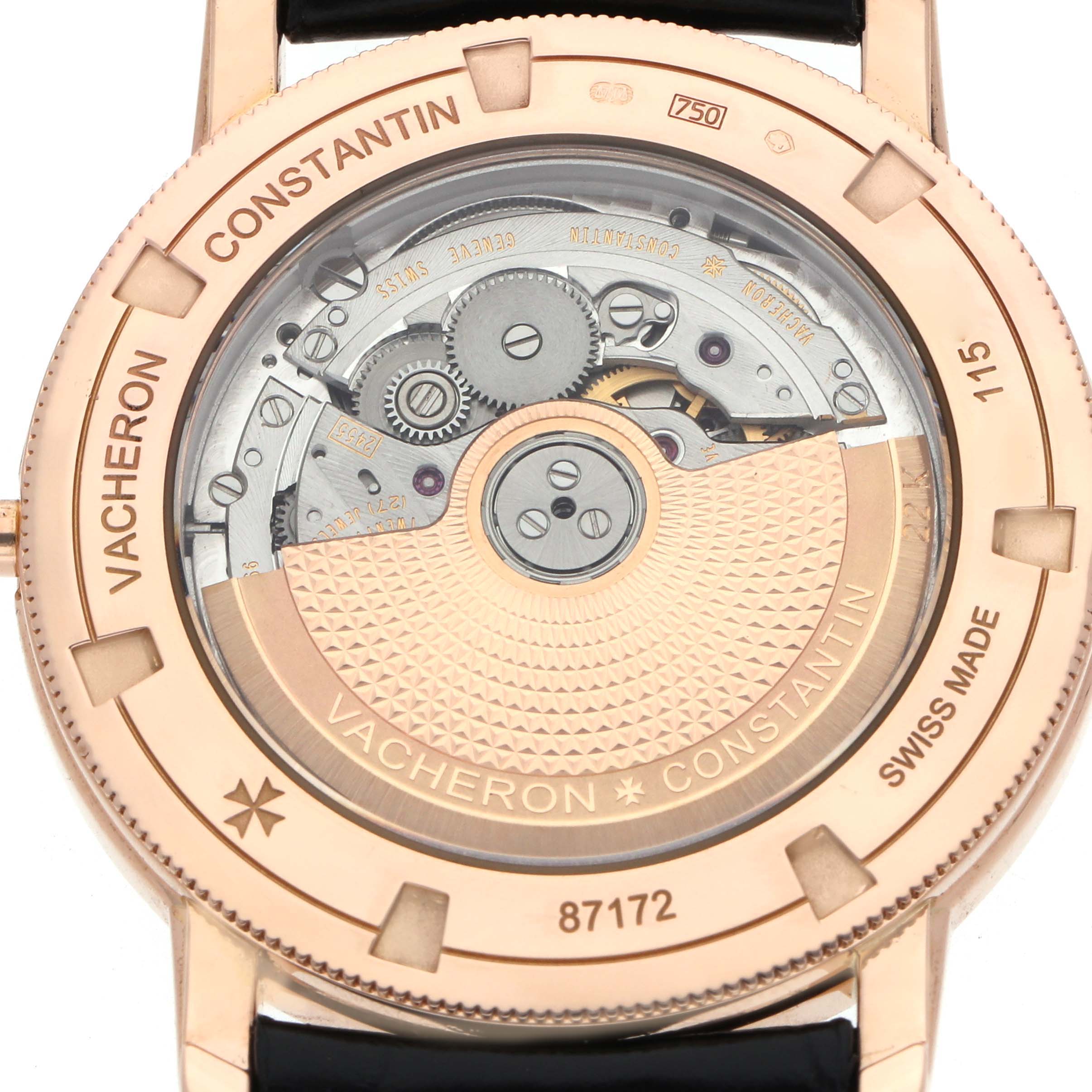 The image shows the back of the Vacheron Constantin Traditionnelle 87172 Men
s Rose Gold Black Dial watch, highlighting the intricate movement and rotor.