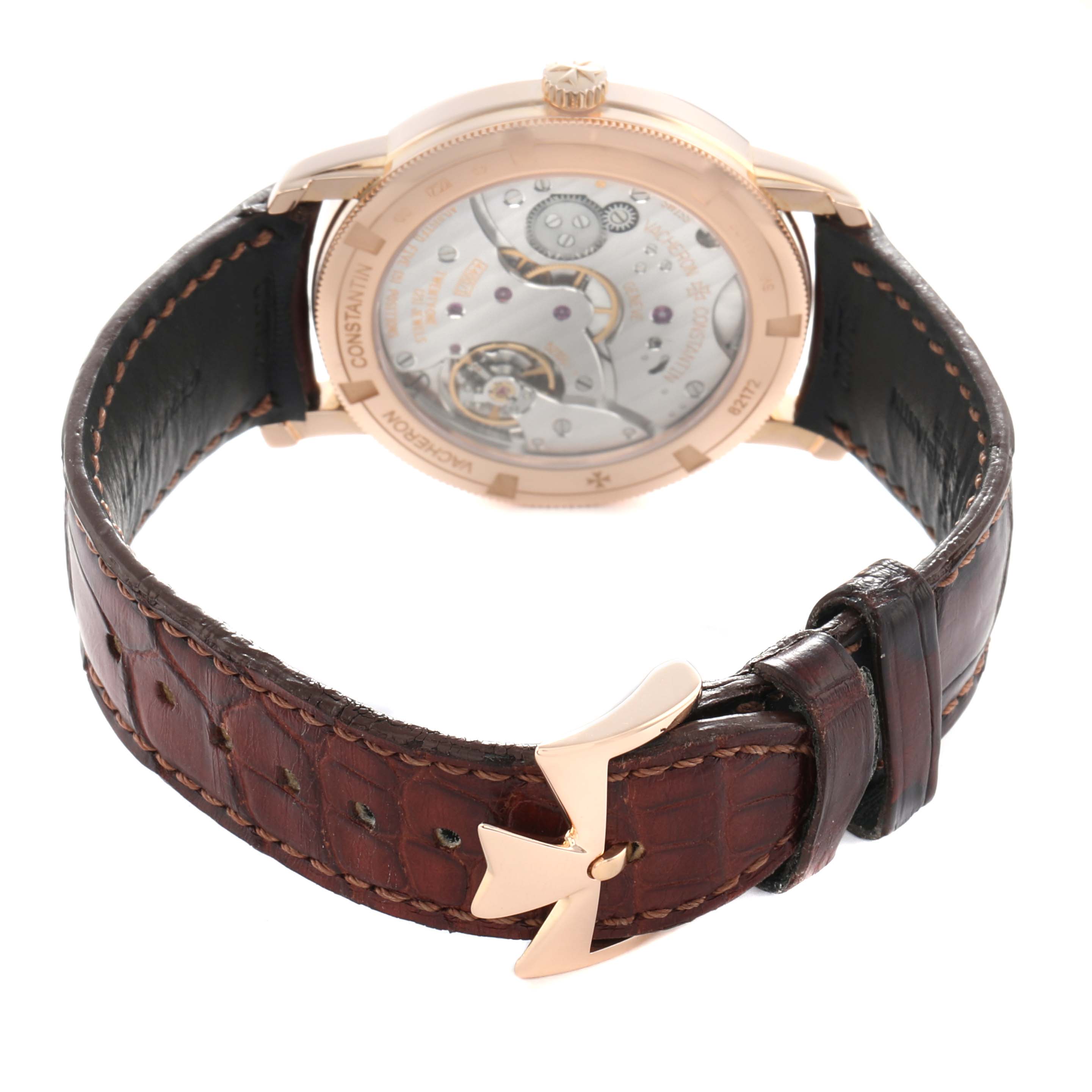 The Vacheron Constantin Traditionnelle 82172 Men
s Rose Gold Silver Dial watch is shown from the back, highlighting the movement and the leather strap with a visible buckle.