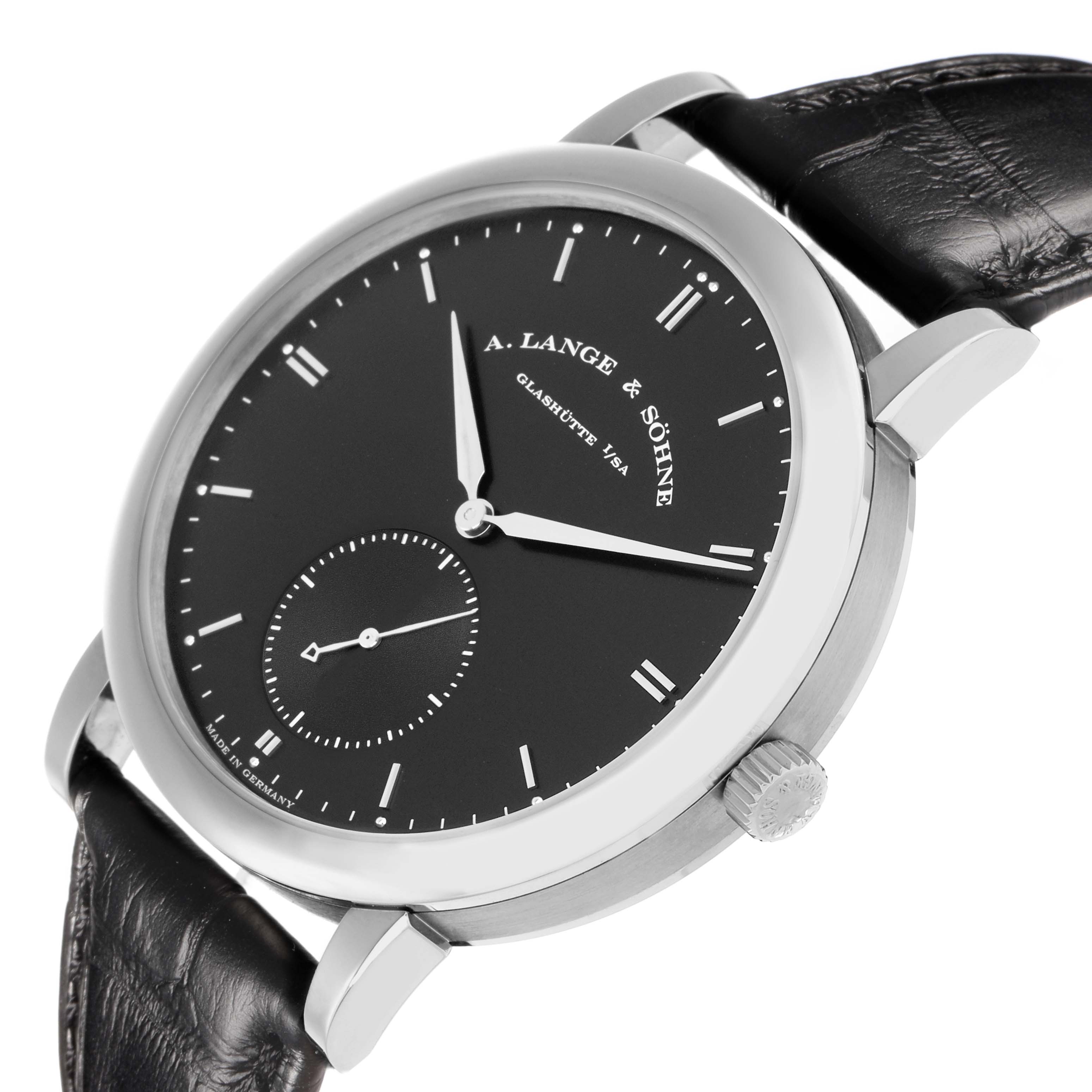 The A. Lange 
Sohne Saxonia 307.029 Men
s White Gold Black Dial watch is shown from a slightly angled side view, highlighting the dial, case, crown, and leather strap.