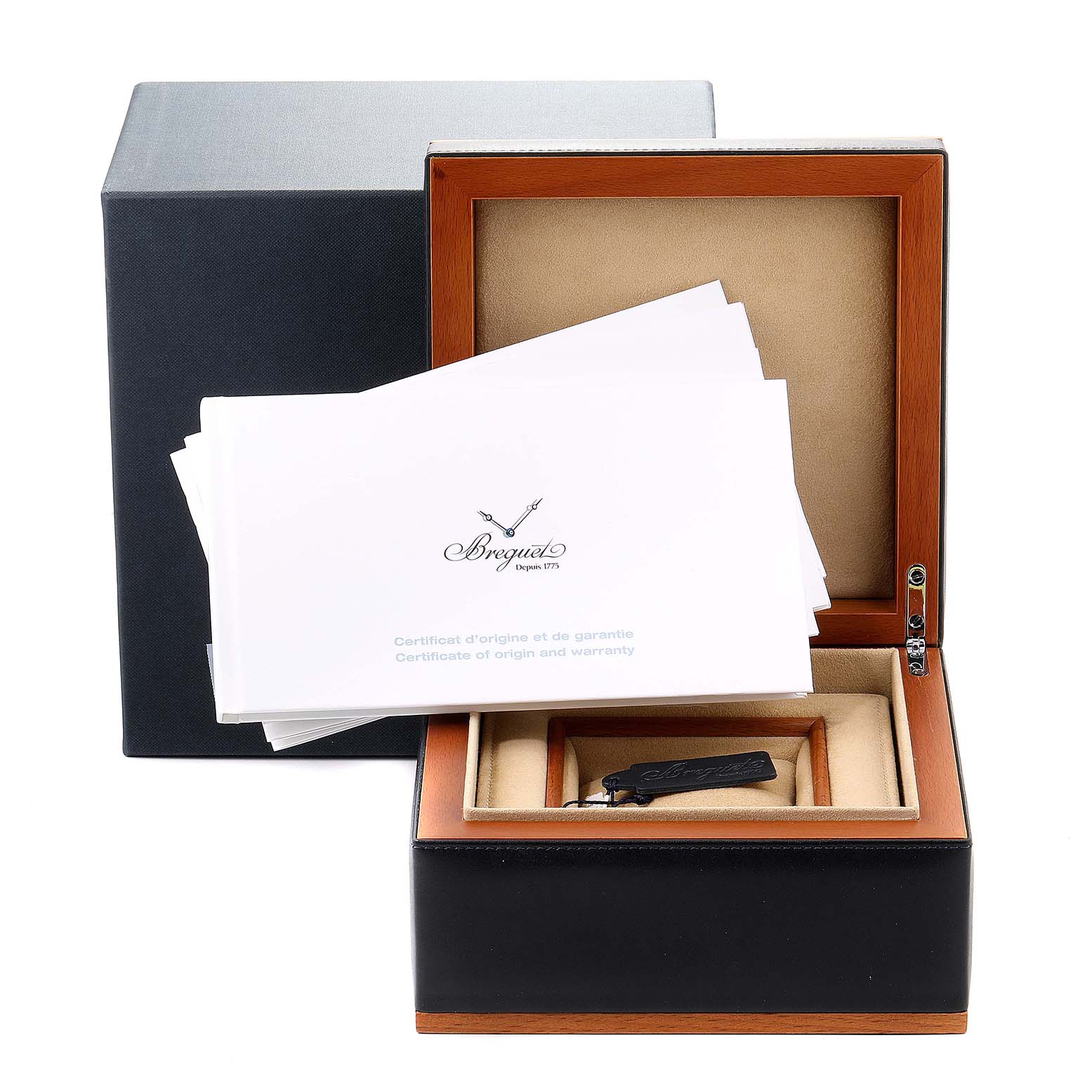 The image shows an open box of a Breguet Type XX - XXI - XXII 3817ST/X2/3ZU Men's Stainless Steel Grey Dial 3817ST/X2/3ZU Men's Stainless Steel Grey Dial watch with certificates and a small tag inside.