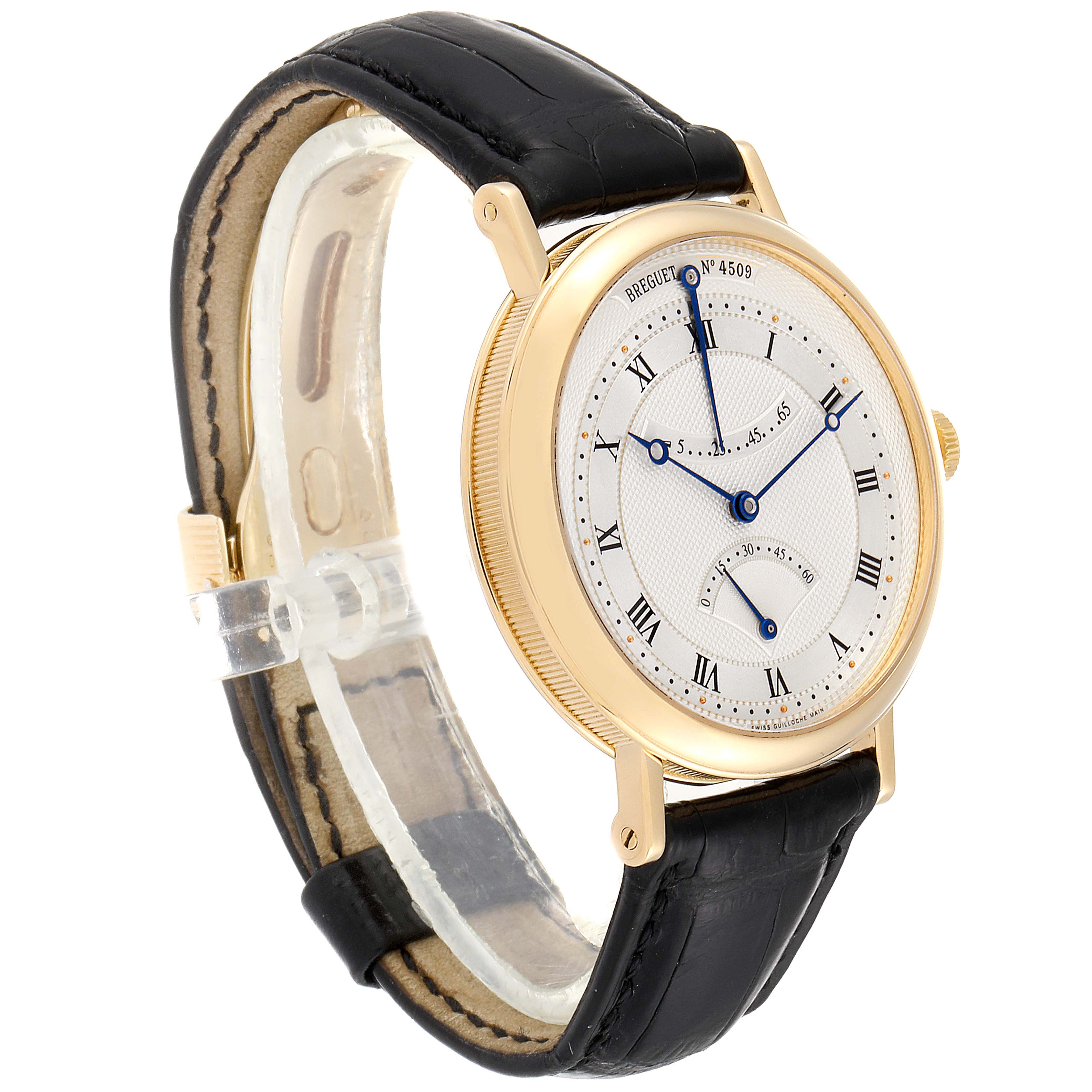 The Breguet Classique 5207BA/12/9V6 Men's Yellow Gold Silver Dial 5207BA/12/9V6 Men's Yellow Gold Silver Dial watch is shown at a three-quarter angle, highlighting the face, hour markers, and black leather strap.