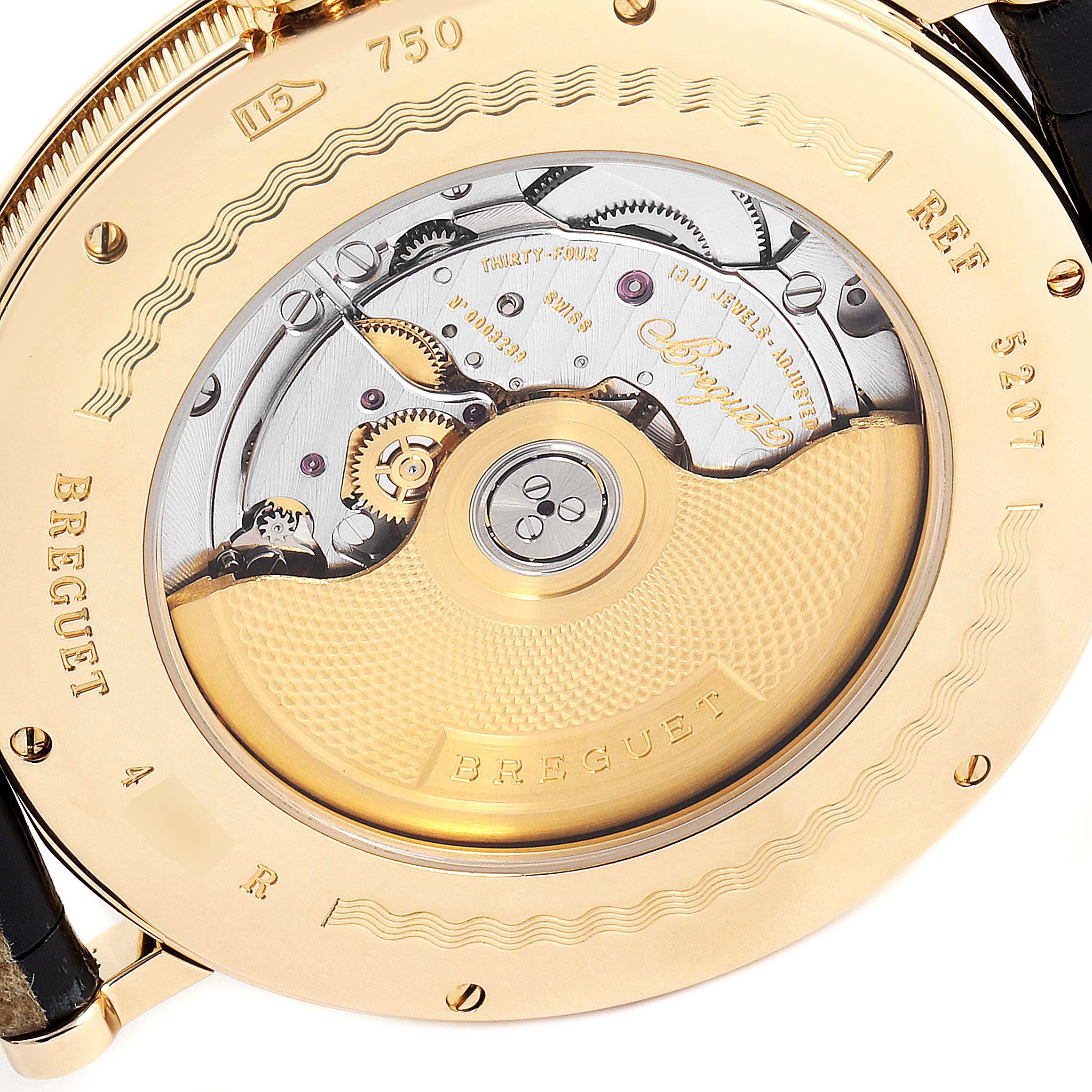 The image shows the back view of the Breguet Classique 5207BA/12/9V6 Men's Yellow Gold Silver Dial 5207BA/12/9V6 Men's Yellow Gold Silver Dial model, showcasing its intricate movement and automatic rotor.