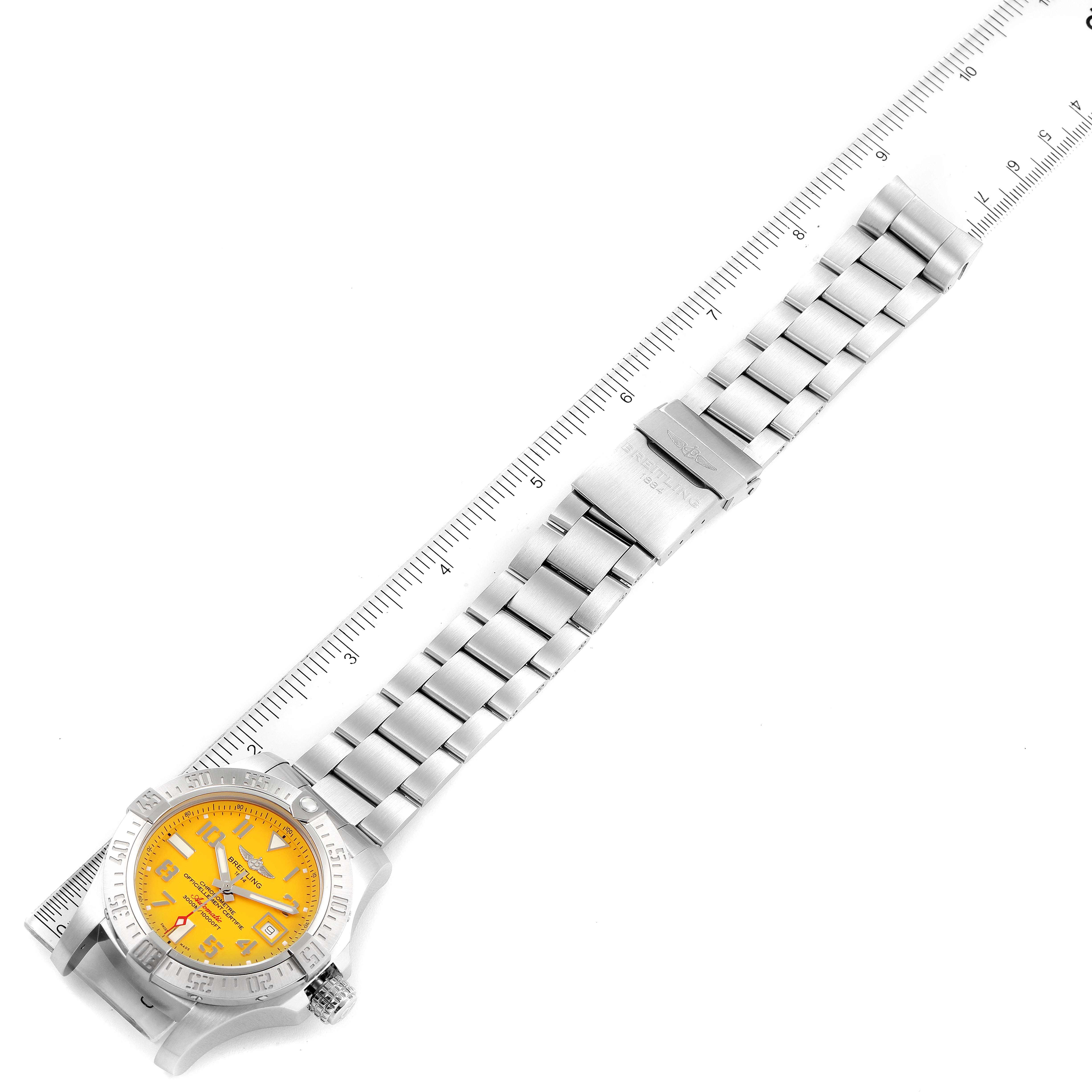 The Breitling Avenger A17331 Men's Stainless Steel Yellow Dial A17331 Men's Stainless Steel Yellow Dial watch is shown from a top-down angle, highlighting the bracelet, clasp, and yellow dial face.