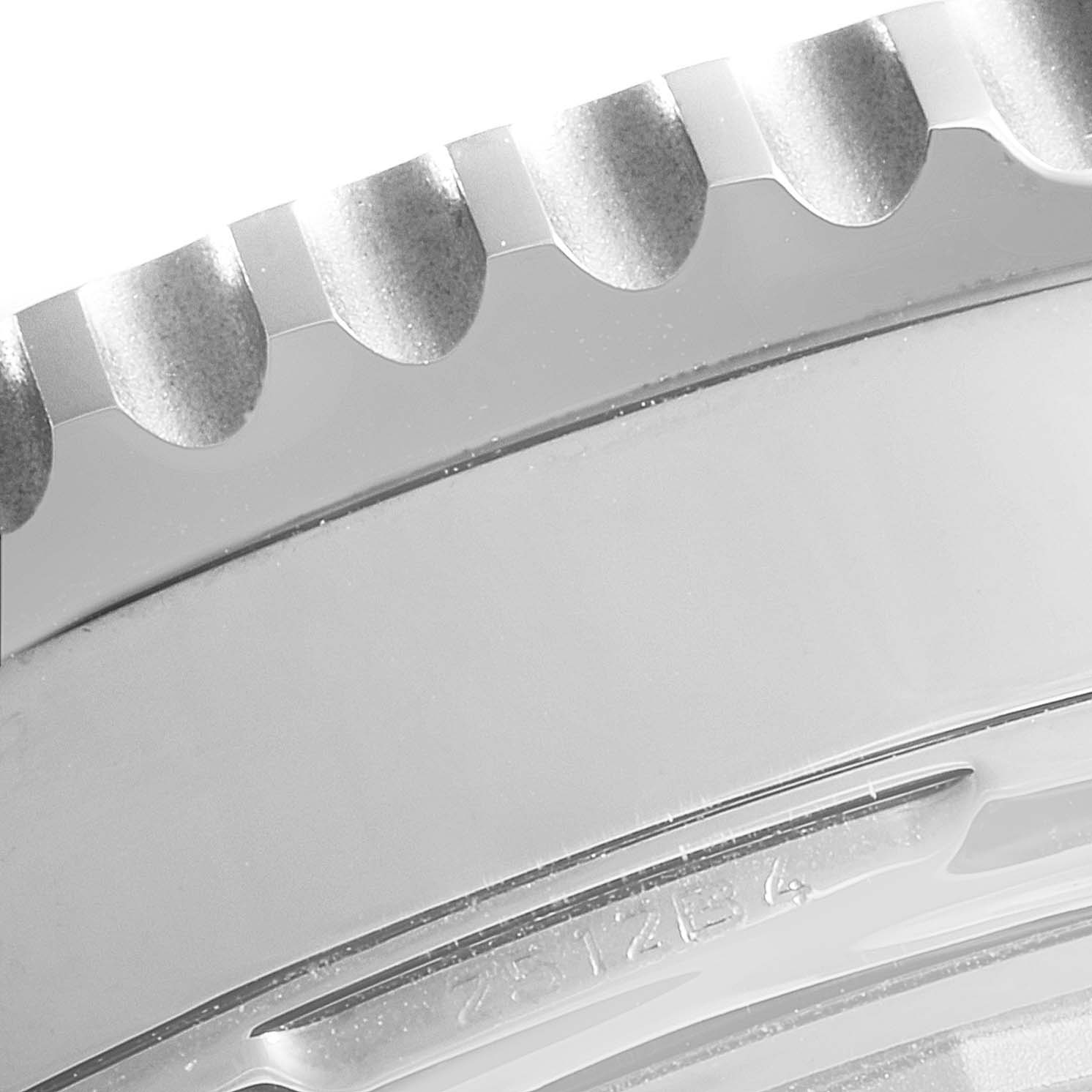 Close-up of the bezel and part of the case of the Breitling Navitimer AB0210 Men
s Stainless Steel Black Dial AB0210 Men
s Stainless Steel Black Dial model watch.