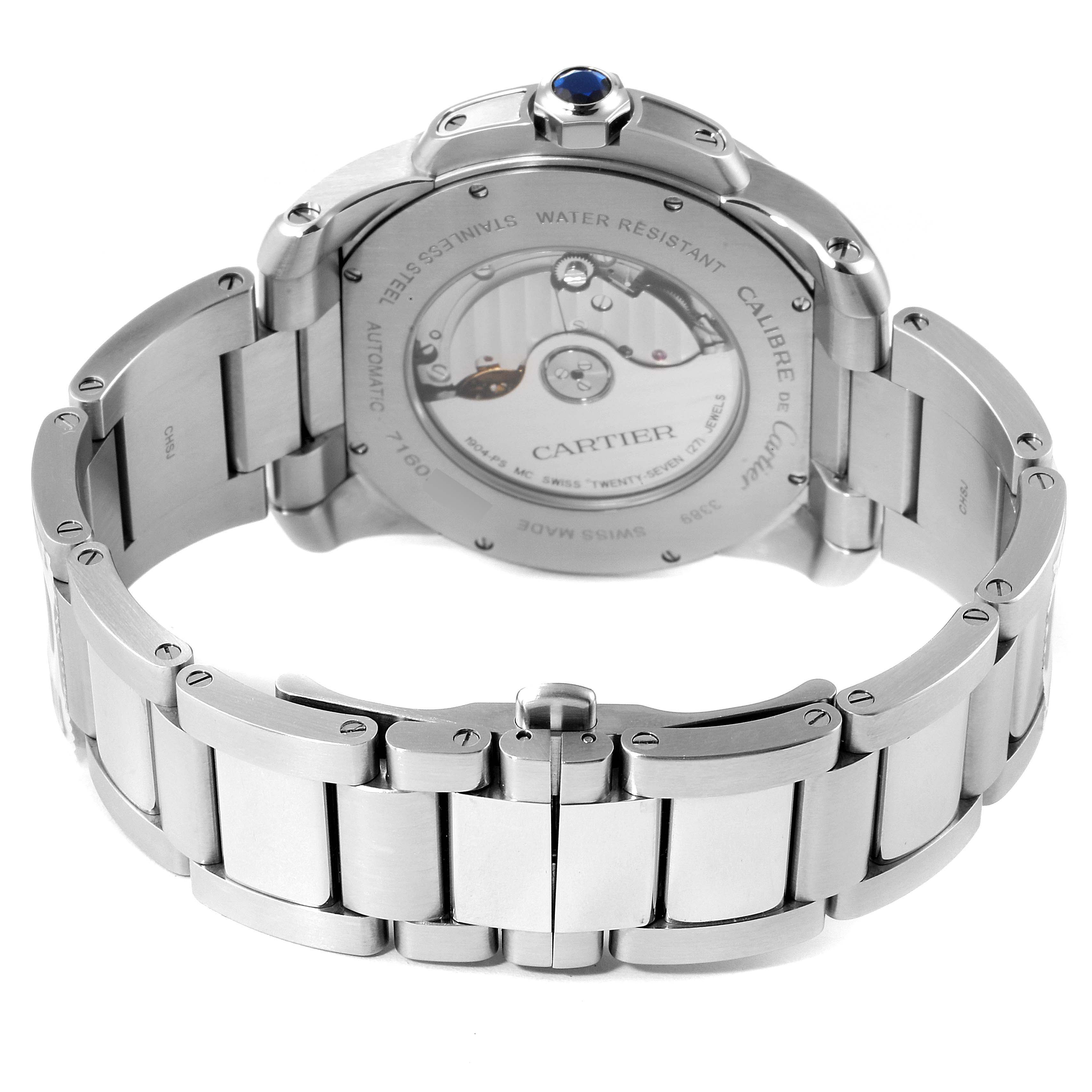 The image shows the back view of the Calibre de Cartier watch by Cartier, highlighting its stainless steel bracelet and automatic movement.
