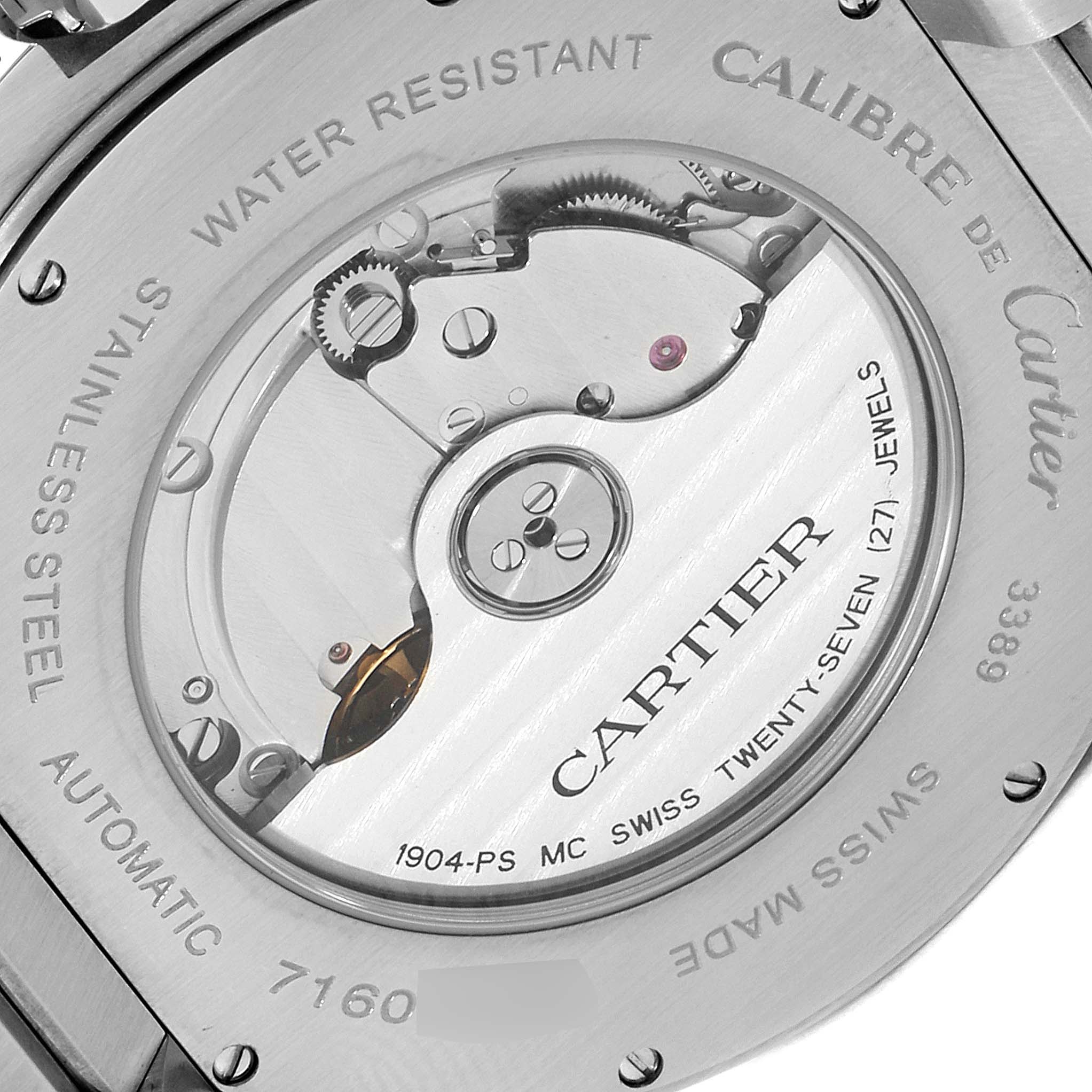 The image shows the back of a Calibre de Cartier watch by Cartier, highlighting its automatic movement and internal components.