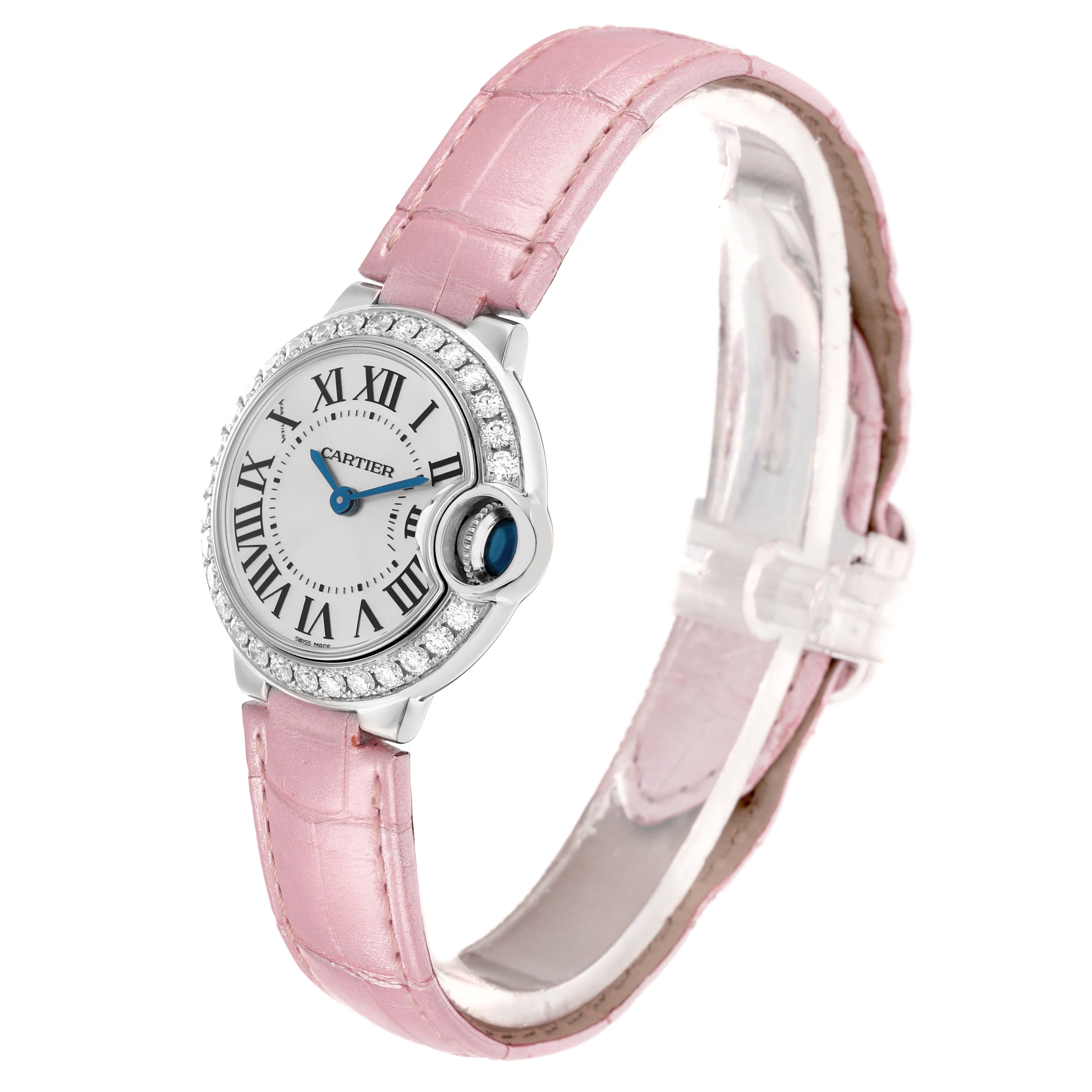 The Cartier Ballon Bleu WE900351 Women
s White Gold Silver Dial watch is shown at a slight angle, highlighting its face, pink strap, and prominent crown.