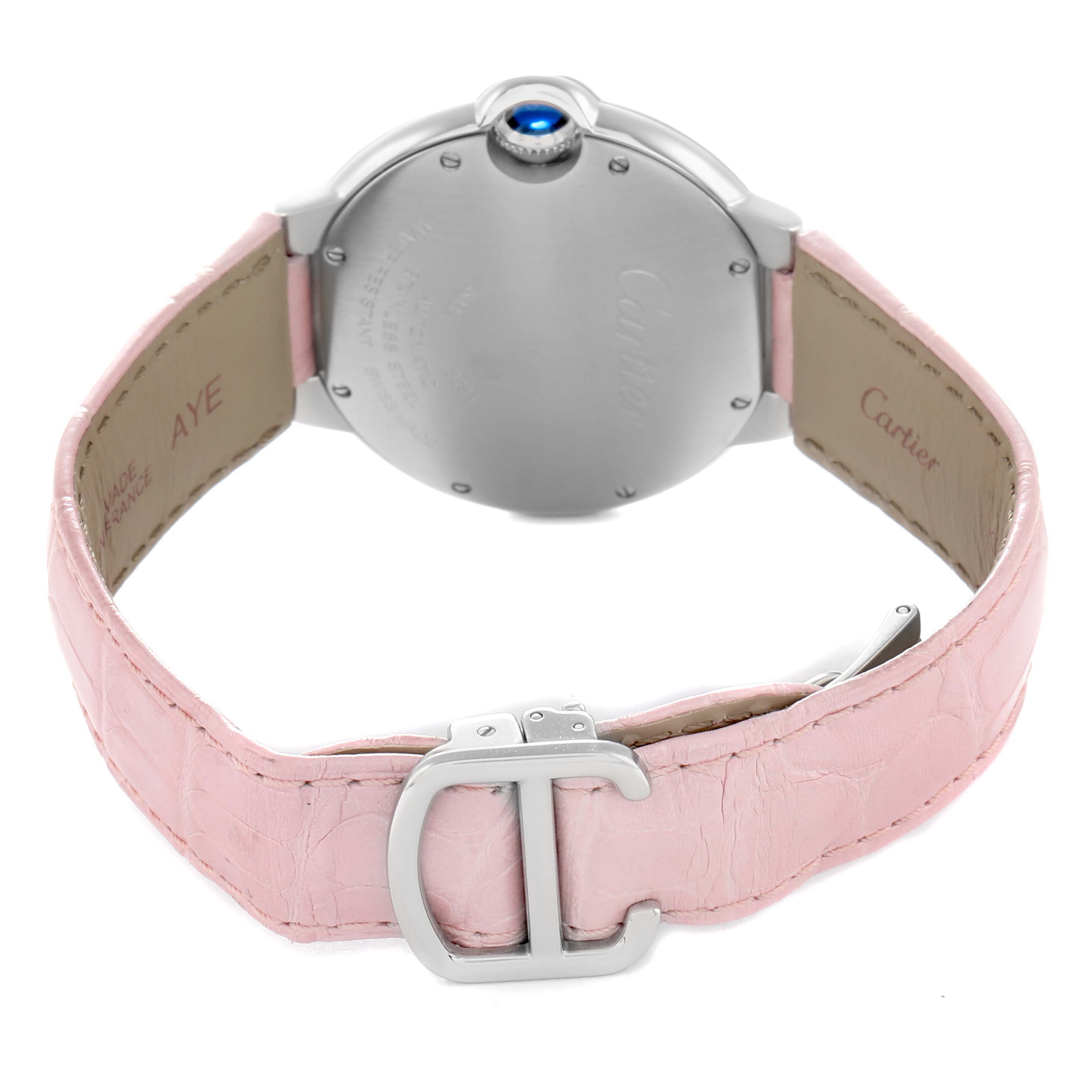 The Cartier Ballon Bleu WSBB0007 Women
s Stainless Steel Pink Dial watch is shown from the back, highlighting the case, blue crown, and pink leather strap with a clasp.
