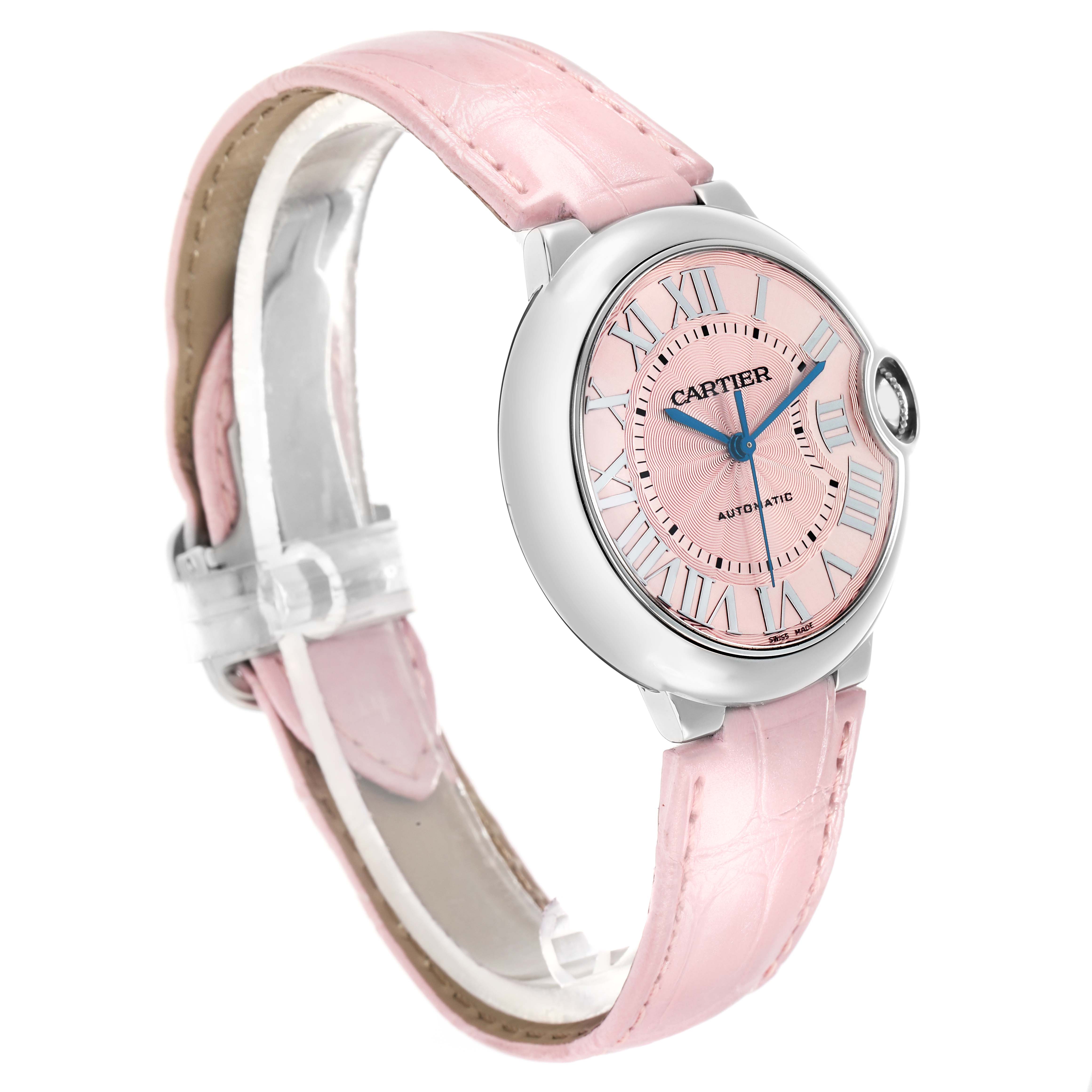 The image shows a Cartier Ballon Bleu WSBB0007 Women
s Stainless Steel Pink Dial watch at a three-quarter angle, highlighting the pink dial, silver case, and matching pink strap.
