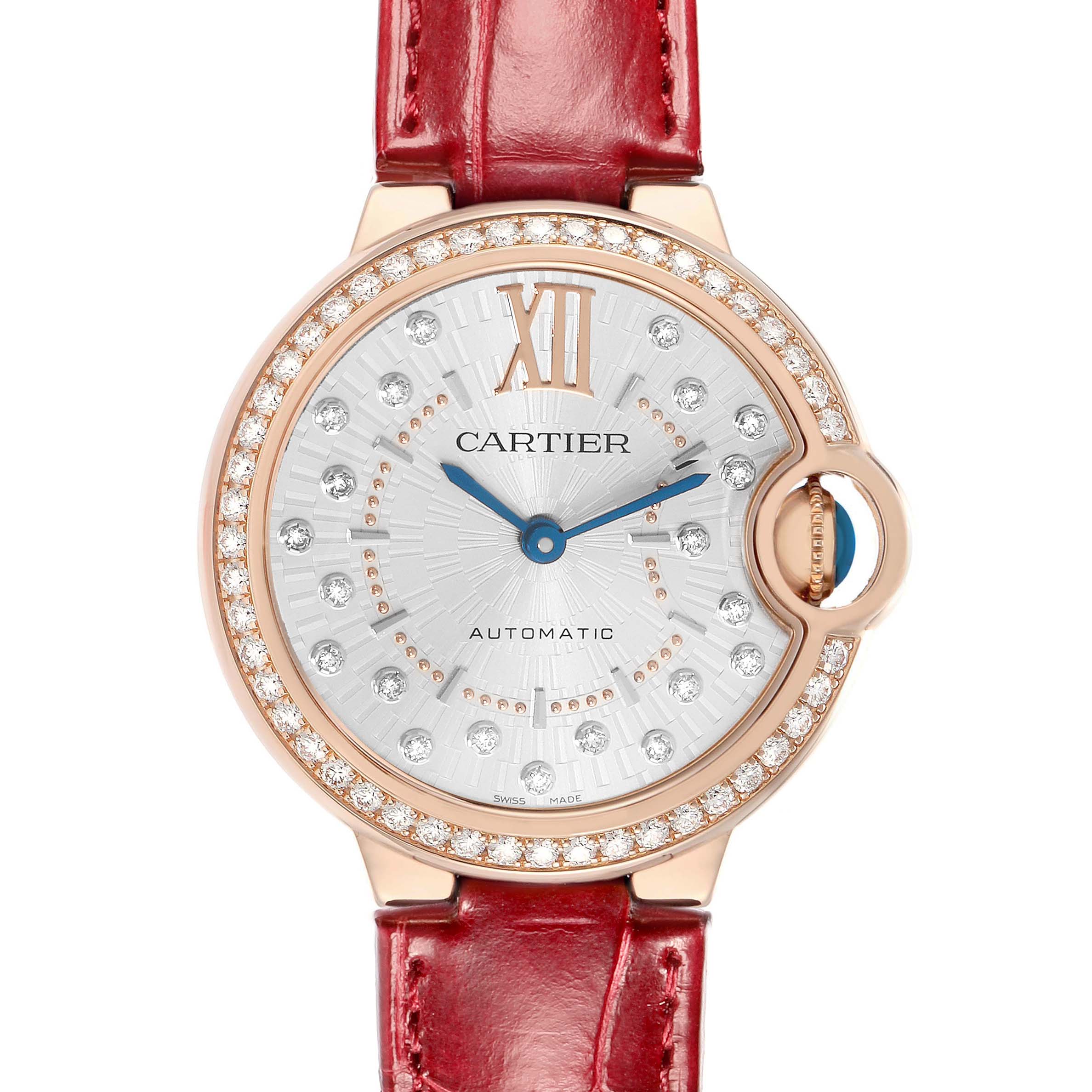The Cartier Ballon Bleu WJBB0080 Women
s Rose Gold Silver Dial watch is shown from the front, displaying its face, red strap, diamond bezel, and blue hands.