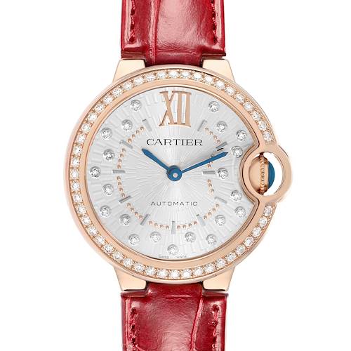 The Cartier Ballon Bleu WJBB0080 Women's Rose Gold Silver Dial watch is shown from the front, highlighting its dial, bezel, crown, and red strap.