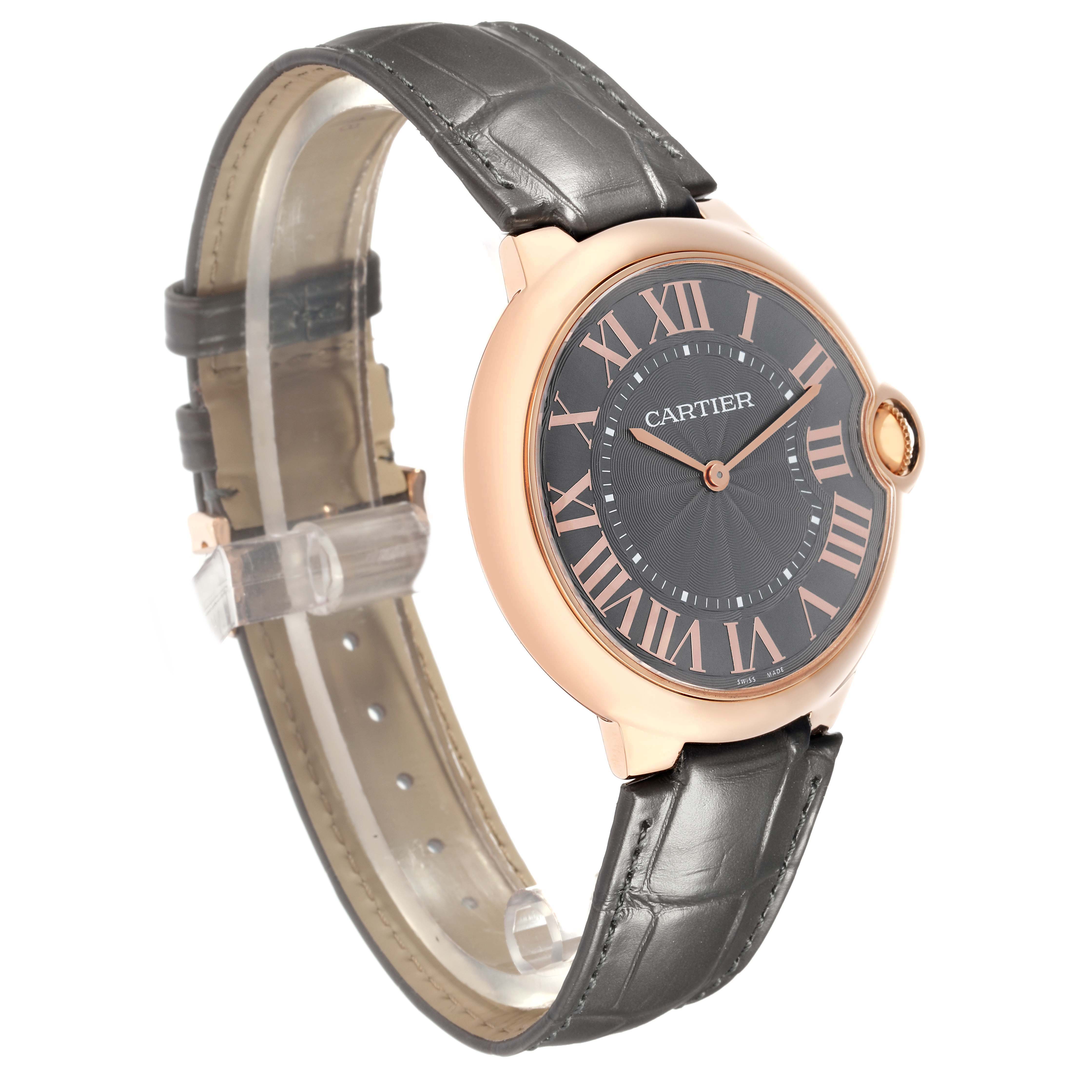 The Cartier Ballon Bleu W6920089 Men
s Rose Gold Grey Dial watch is shown in a three-quarter angle, highlighting its face and leather strap.