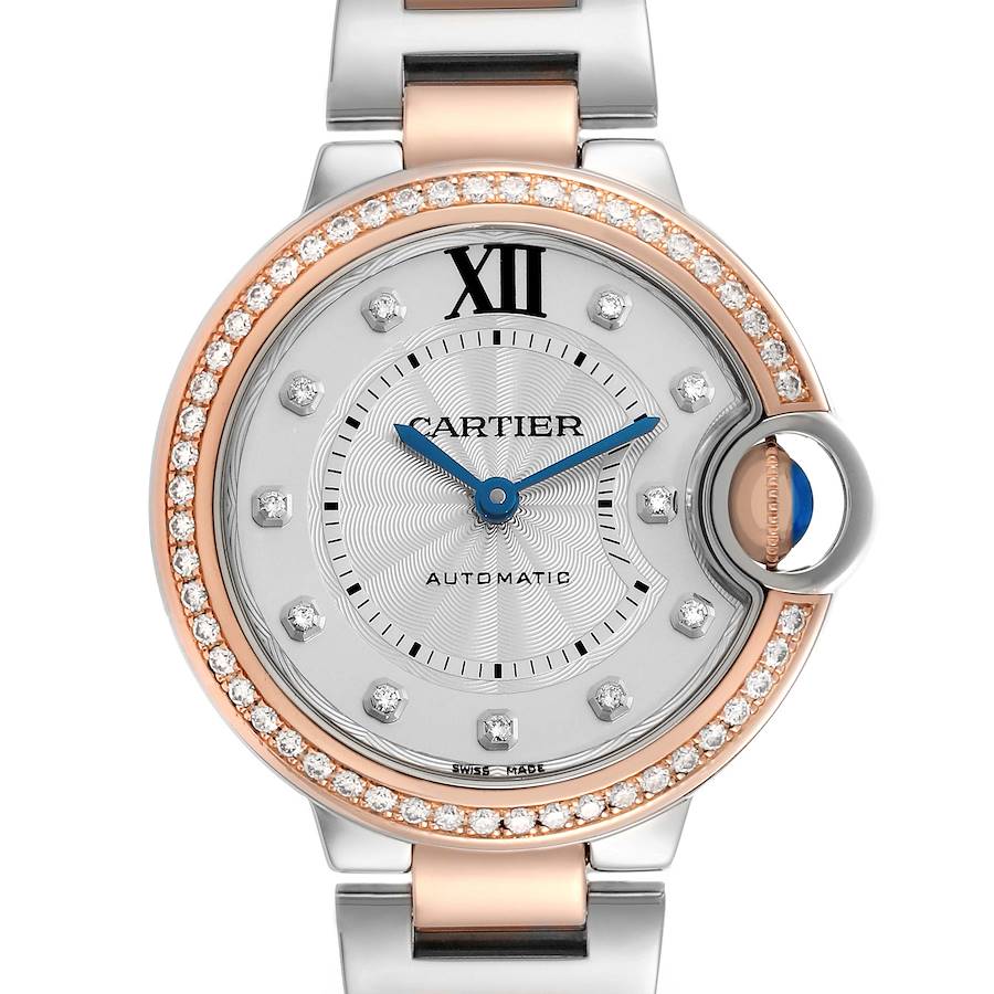 The Cartier Ballon Bleu WE902077 Women's Steel and Gold (two tone) Silver Dial watch is shown from the front, highlighting its diamond bezel and two-tone bracelet.