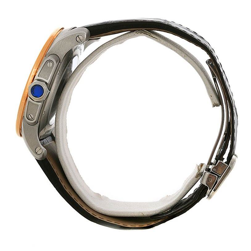 This side view of the Calibre de Cartier watch by Cartier shows the crown, strap, and buckle.