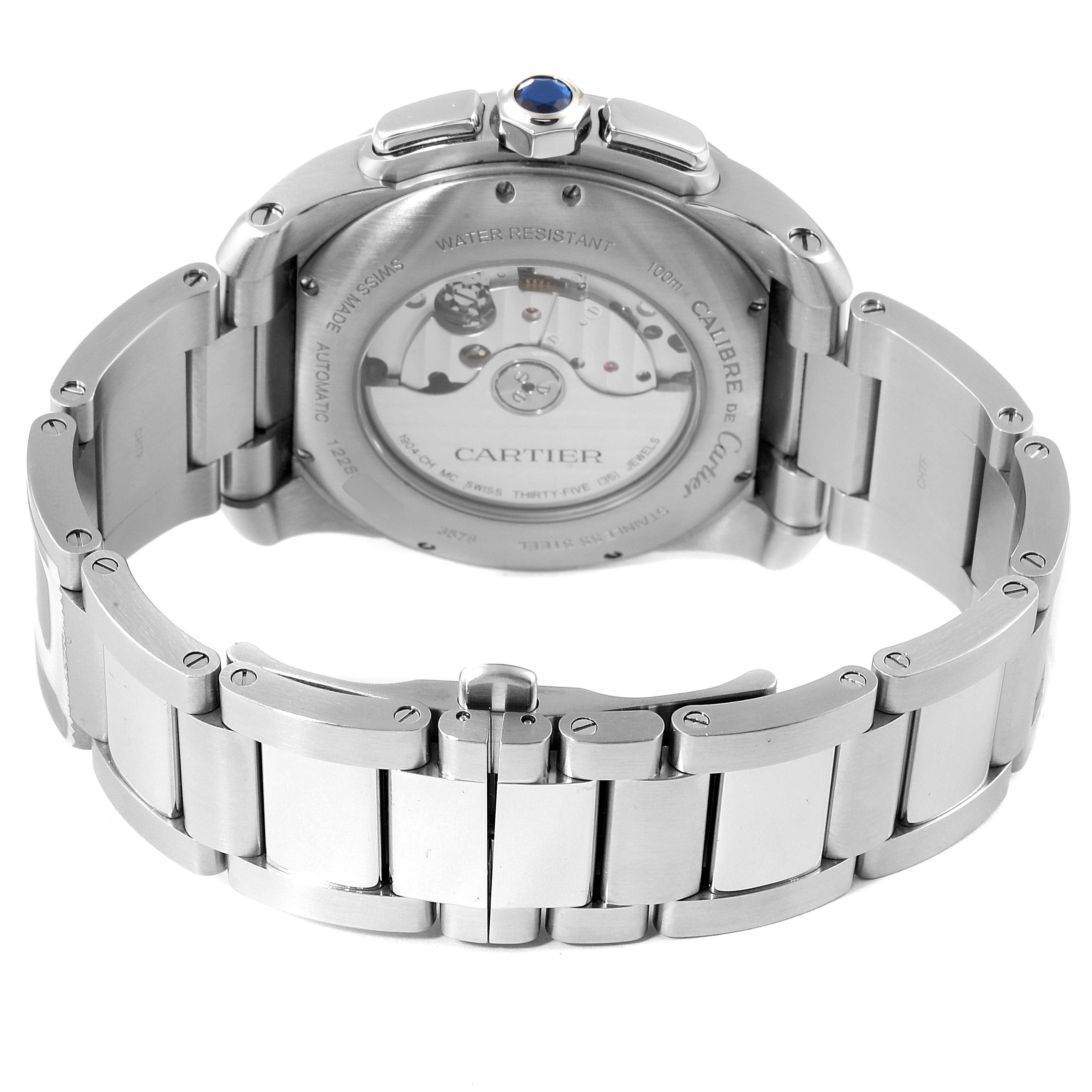 The image shows the back of a Calibre de Cartier model by Cartier, highlighting the metal bracelet and the watch
s automatic movement.