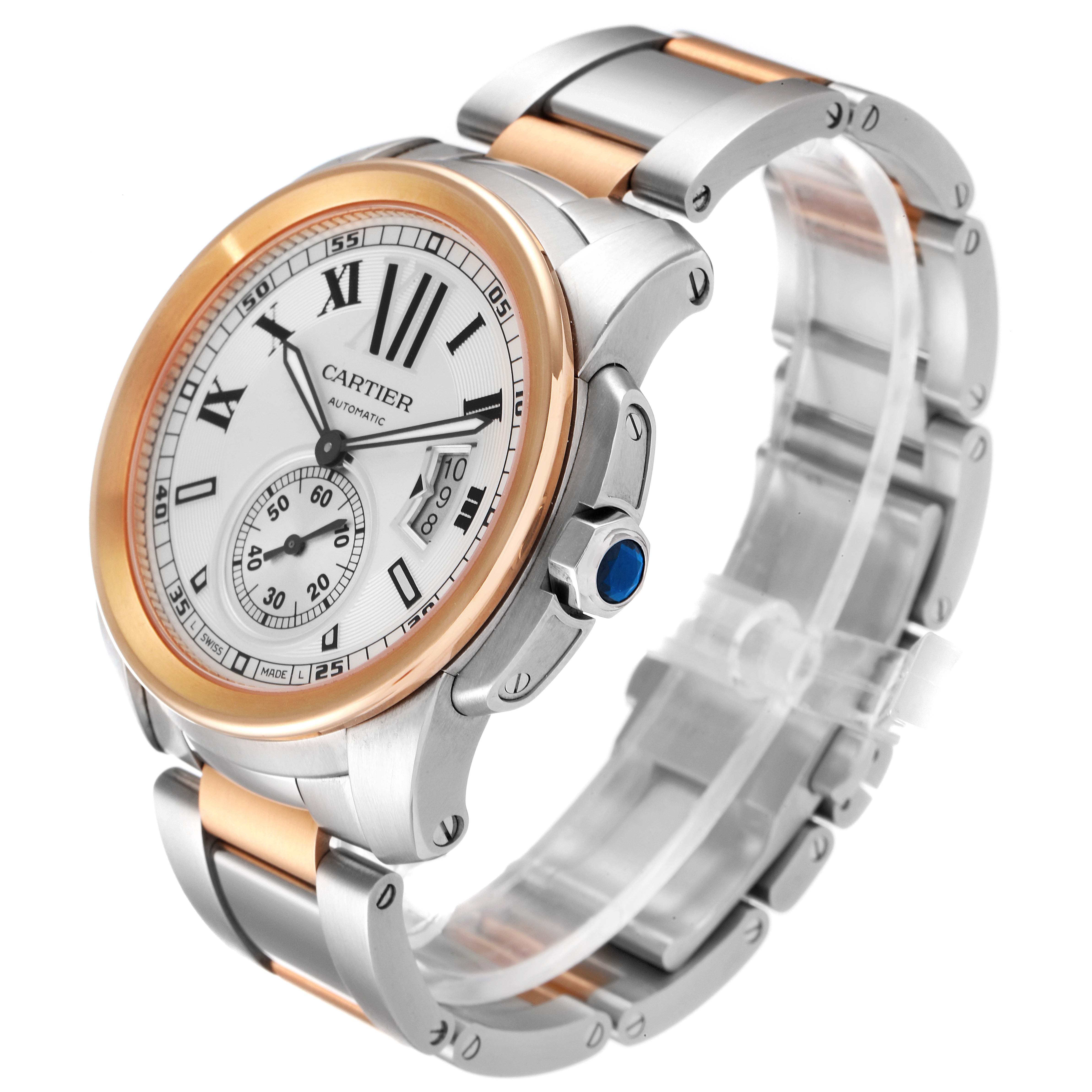 The Calibre de Cartier watch is shown in a three-quarter view, displaying its face, bezel, crown, and bracelet.