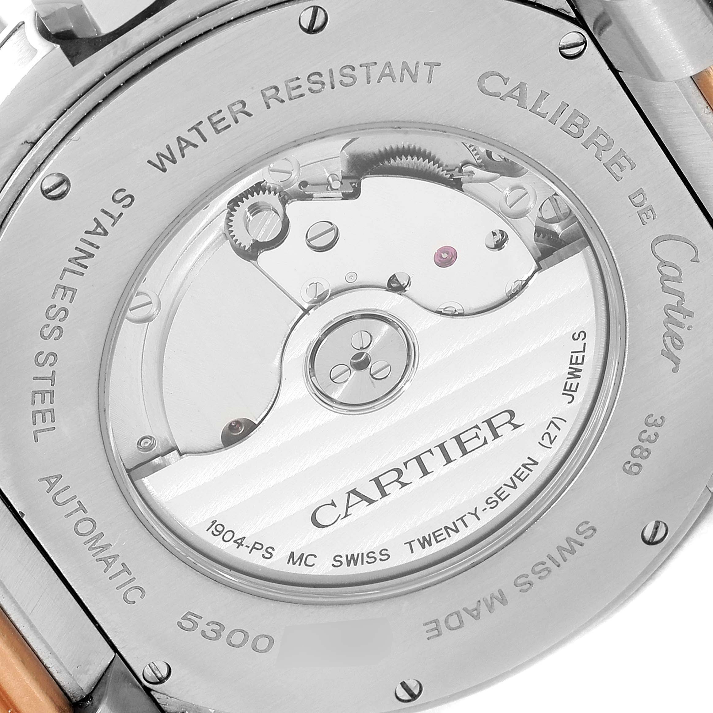 This image shows the back of the Calibre de Cartier watch by Cartier, highlighting the automatic movement and internal mechanism.