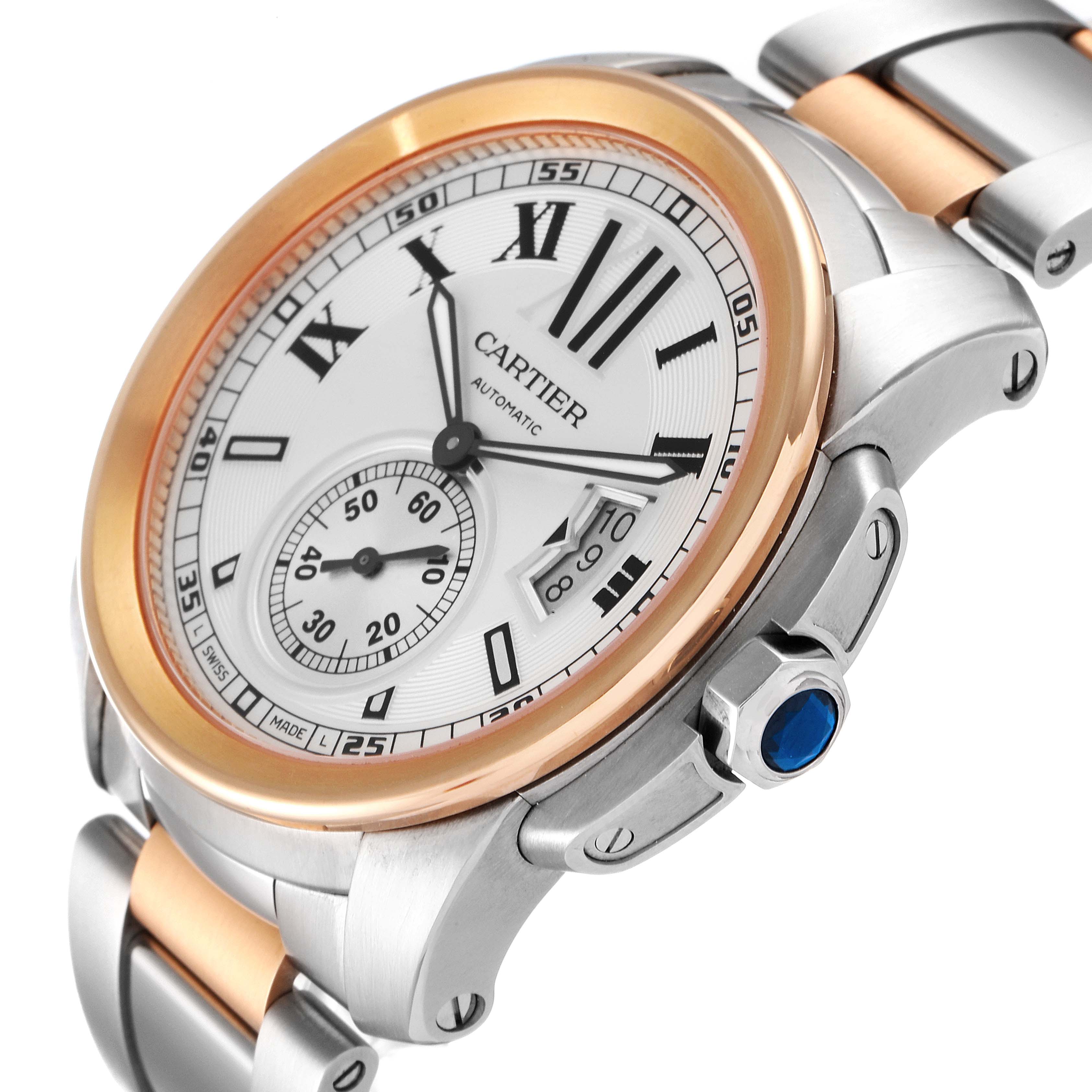 The Calibre de Cartier watch by Cartier is shown at an angled close-up, highlighting the face, bezel, and part of the bracelet.