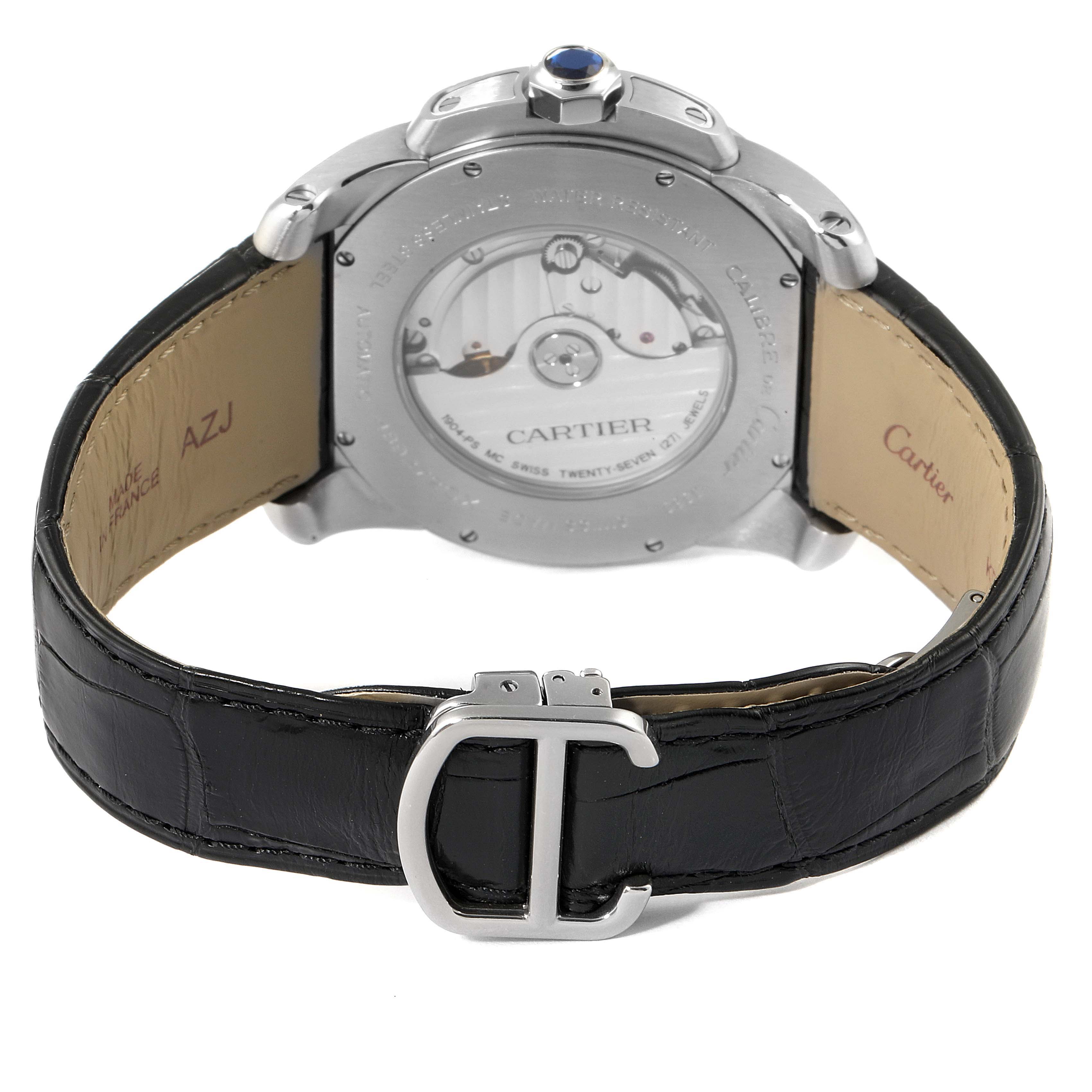 The image shows the back view of a Calibre de Cartier watch by Cartier, highlighting the back case and black leather strap with a "C" buckle.