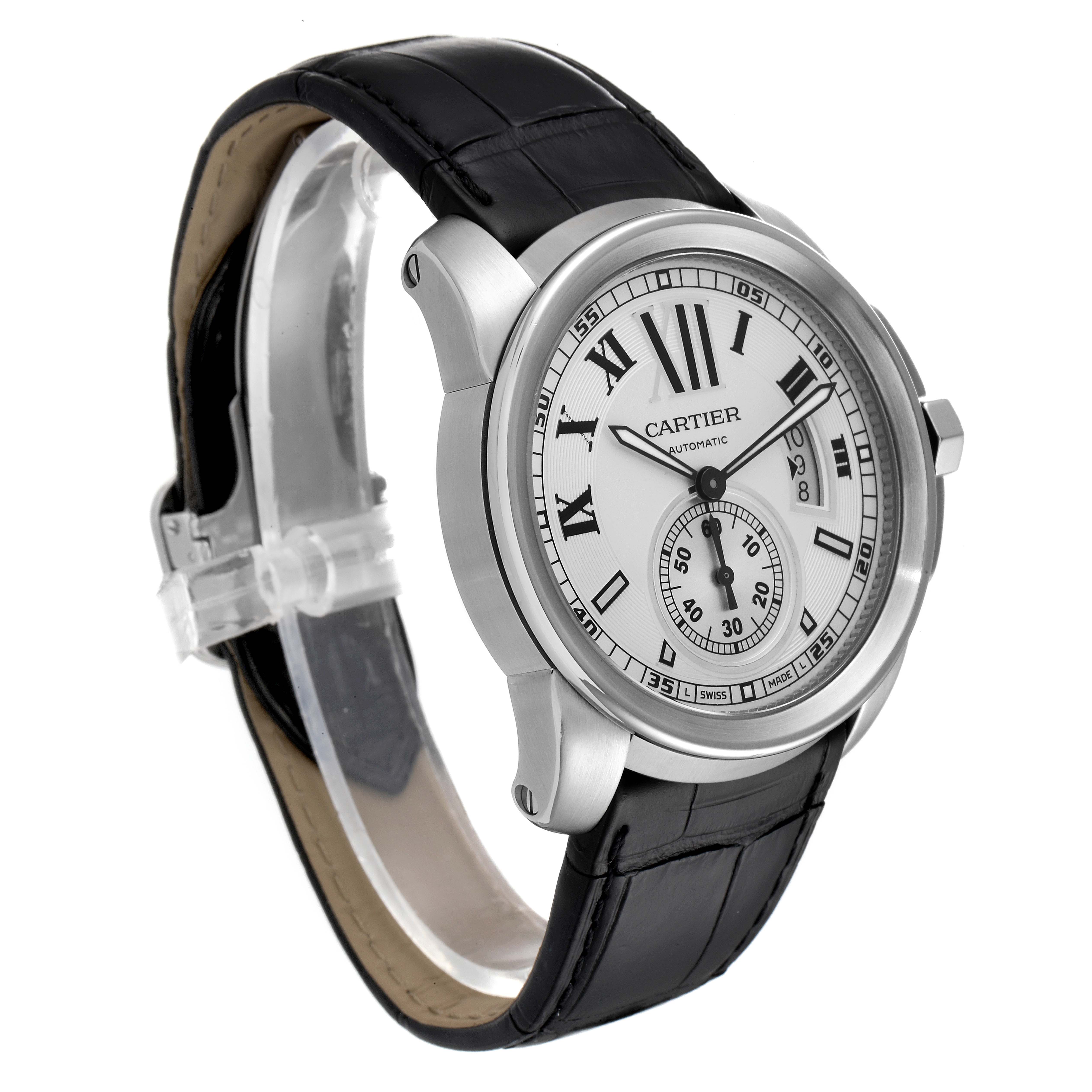 This image shows a Calibre de Cartier watch by Cartier, viewed from a front-right angle, highlighting the dial and strap.
