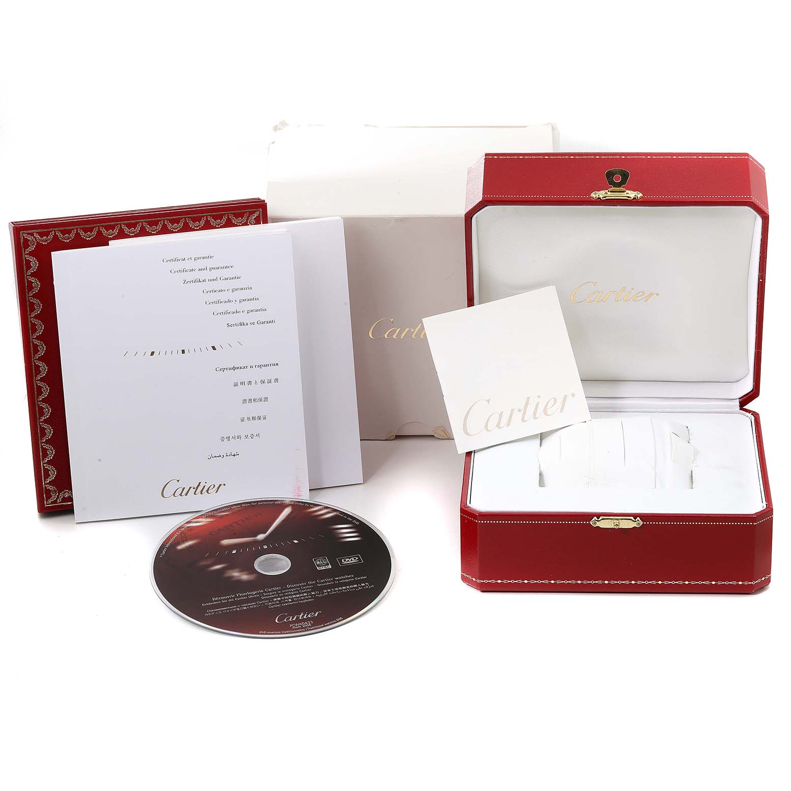 The image shows the packaging, warranty card, manual, and CD for the Calibre de Cartier watch by Cartier.