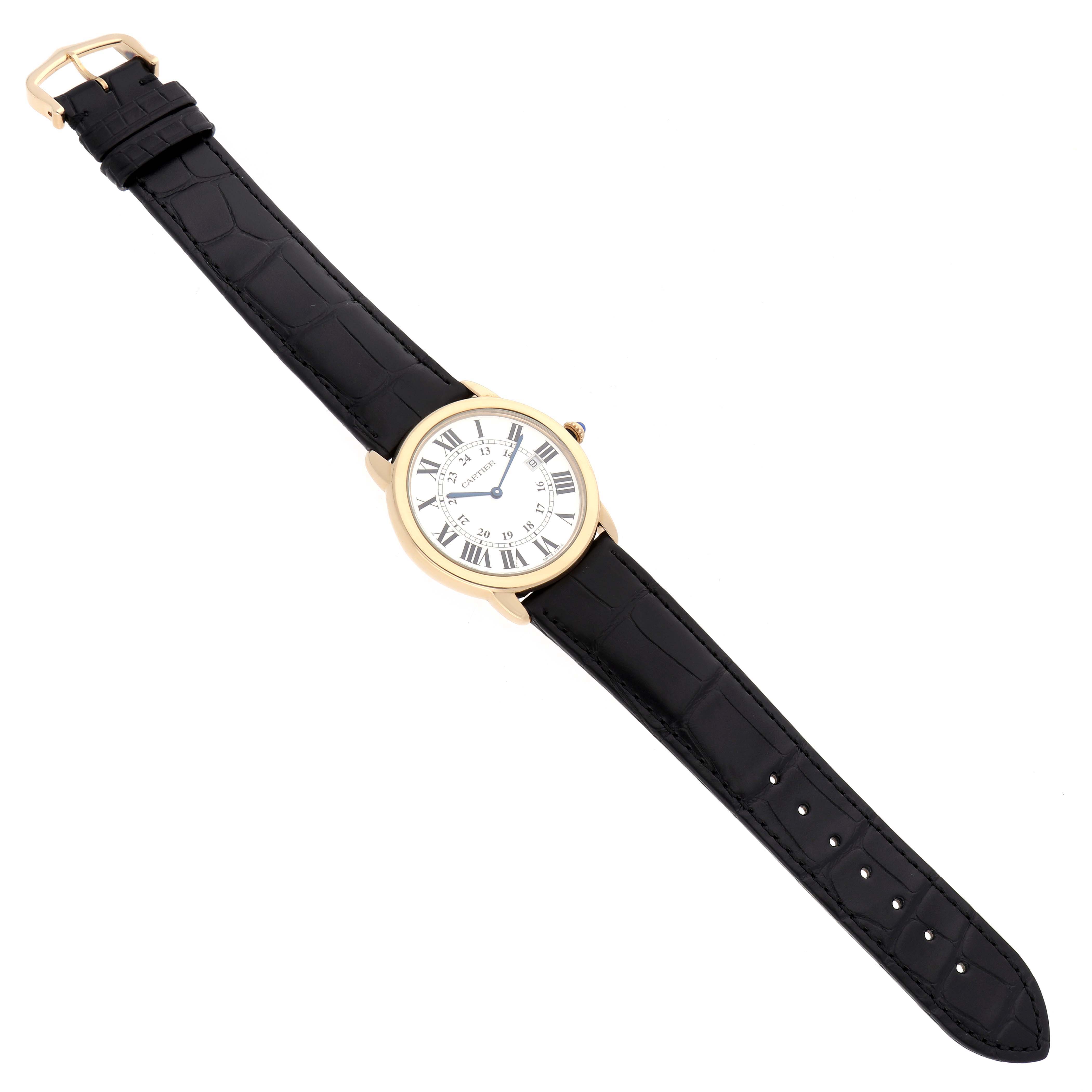 The Cartier Ronde W6700455 Men
s Steel and Gold (two tone) Silver Dial watch is shown from a top-down angle, displaying the face, black leather strap, and gold buckle.