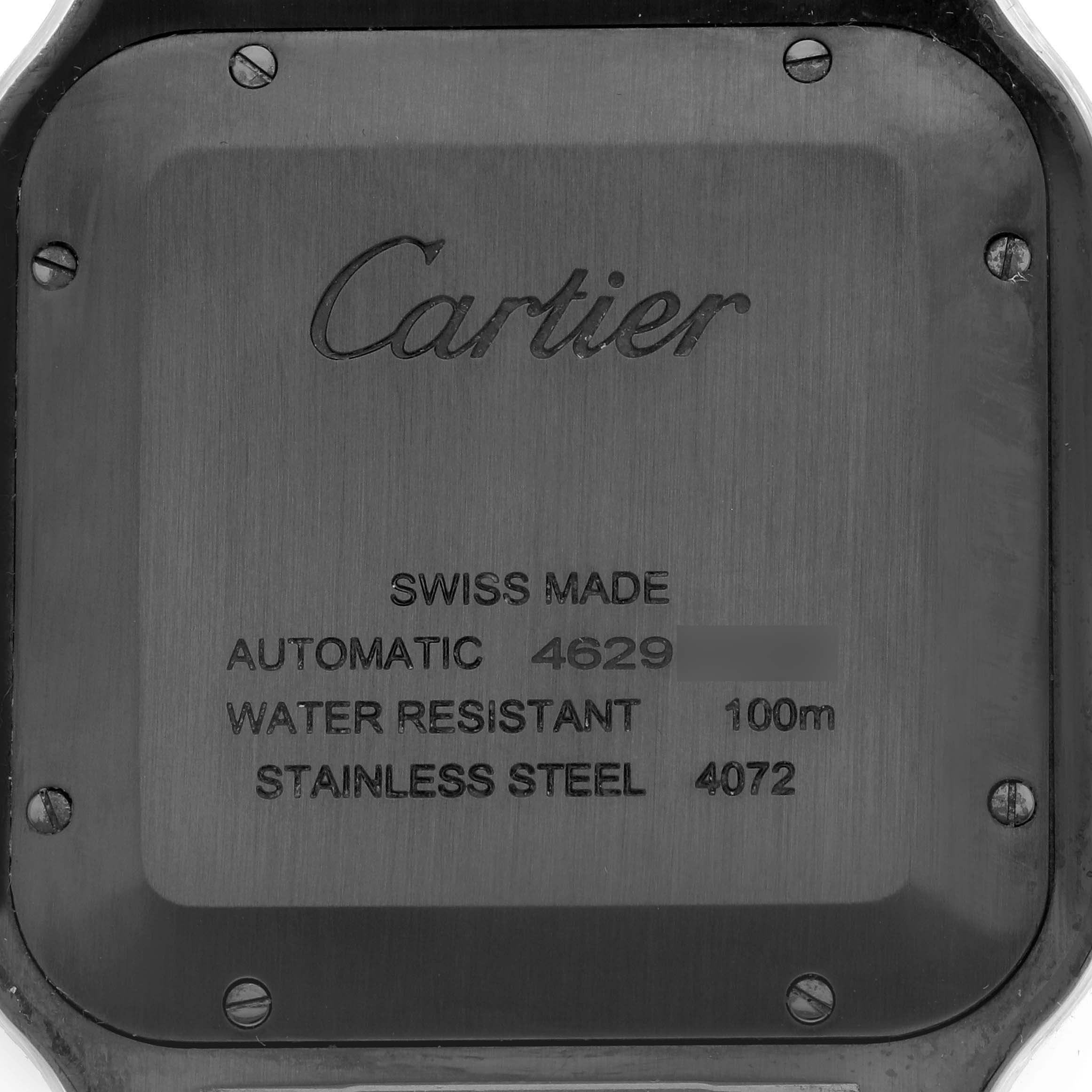 The image shows the case back of a Cartier Santos Dumont WSSA0039 Men
s Stainless Steel Black Dial watch, featuring engraved details.