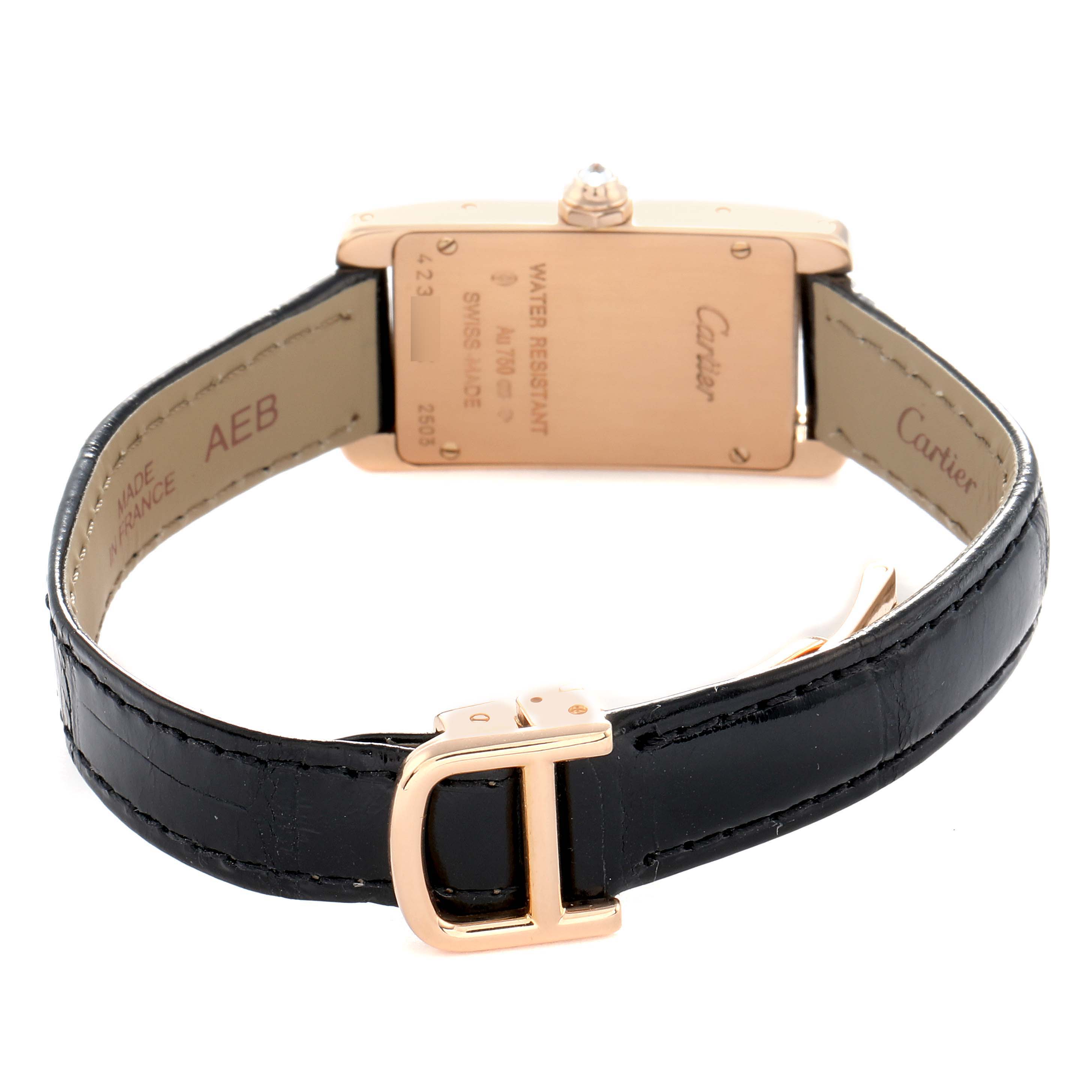 The image shows the back of the Cartier Tank Americaine WJTA0002 Women
s Rose Gold Silver Dial watch, highlighting the case and black leather strap with a gold buckle.