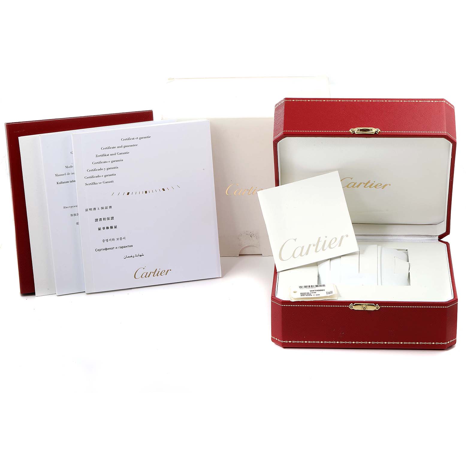 This image shows the packaging and documentation for a Cartier Tank Anglaise W4TA0004 Women's Stainless Steel Silver Dial W4TA0004 Women's Stainless Steel Silver Dial watch, including a red box, instruction manuals, and warranty cards.