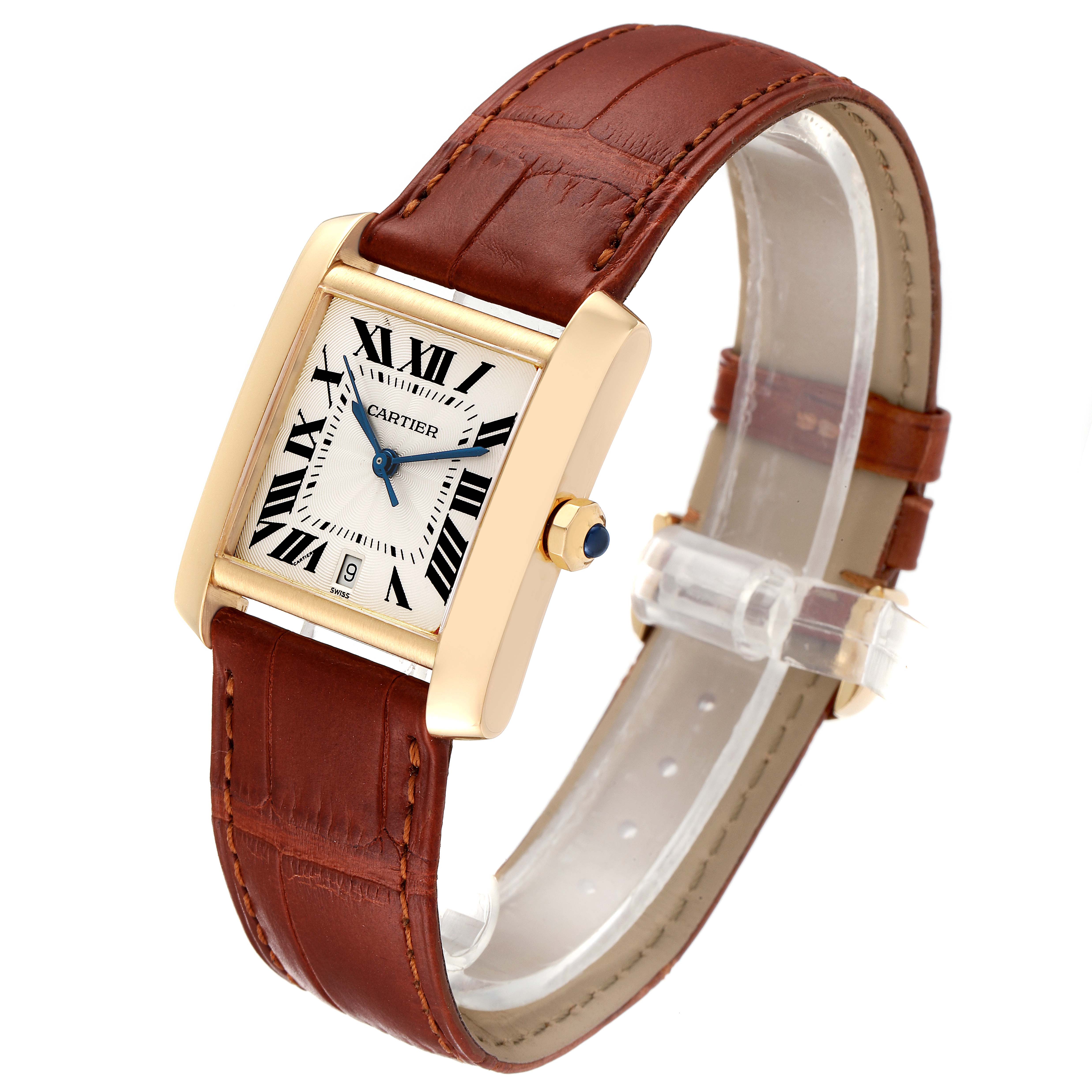The Cartier Tank Francaise W5000156 Men's Yellow Gold Silver Dial W5000156 Men's Yellow Gold Silver Dial watch is shown at an angled view, displaying its face, brown leather strap, and gold casing.